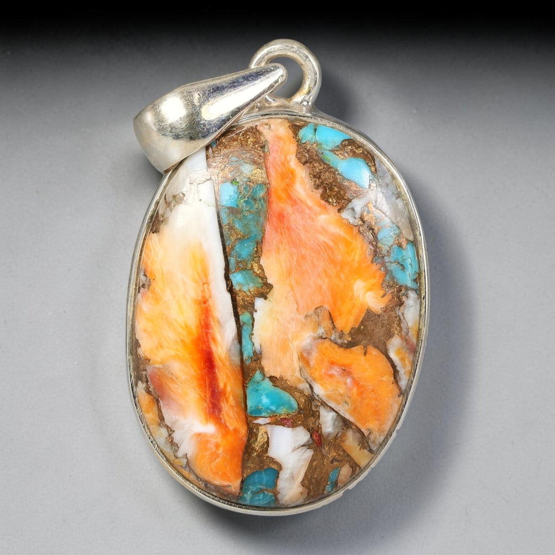 Oyster Turquoise Pendant - 925 Silver Handmade Gemstone, 49TY: This specimen features natural oyster turquoise set within handcrafted sterling silver mount. The polished oval cabochon displays a matrix host with intergrown bright turquoise, orange spiny oyster sh