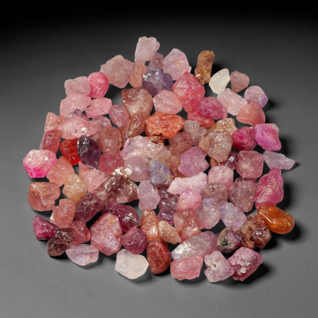131.63ct Natural Multi-Colour Spinel Rough Parcel Loose Gemstone, 89TV: Natural spinel rough parcel showcasing a beautiful array of soft varied hues with subtle tonal differences throughout each crystal. Raw crystalline surfaces carry authentic natural mineral textures an