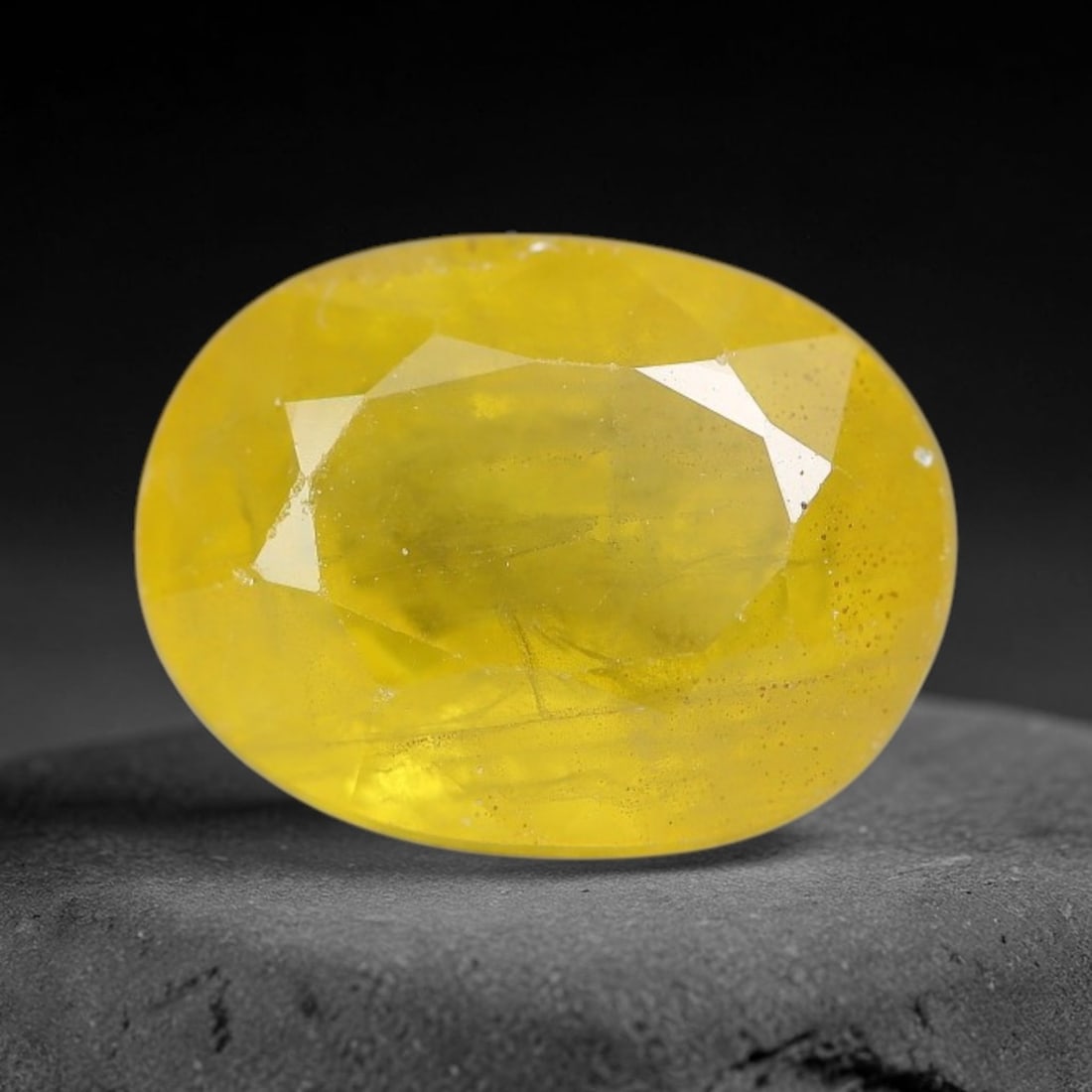3.50 Carats Natural Yellow Sapphire Oval Faceted Loose Gemstone, 33TT: This natural yellow sapphire features a classic oval brilliant faceted cut, holding consistent warm golden-yellow color throughout the corundum crystal. Fine microscopic mineral specks and faint natur