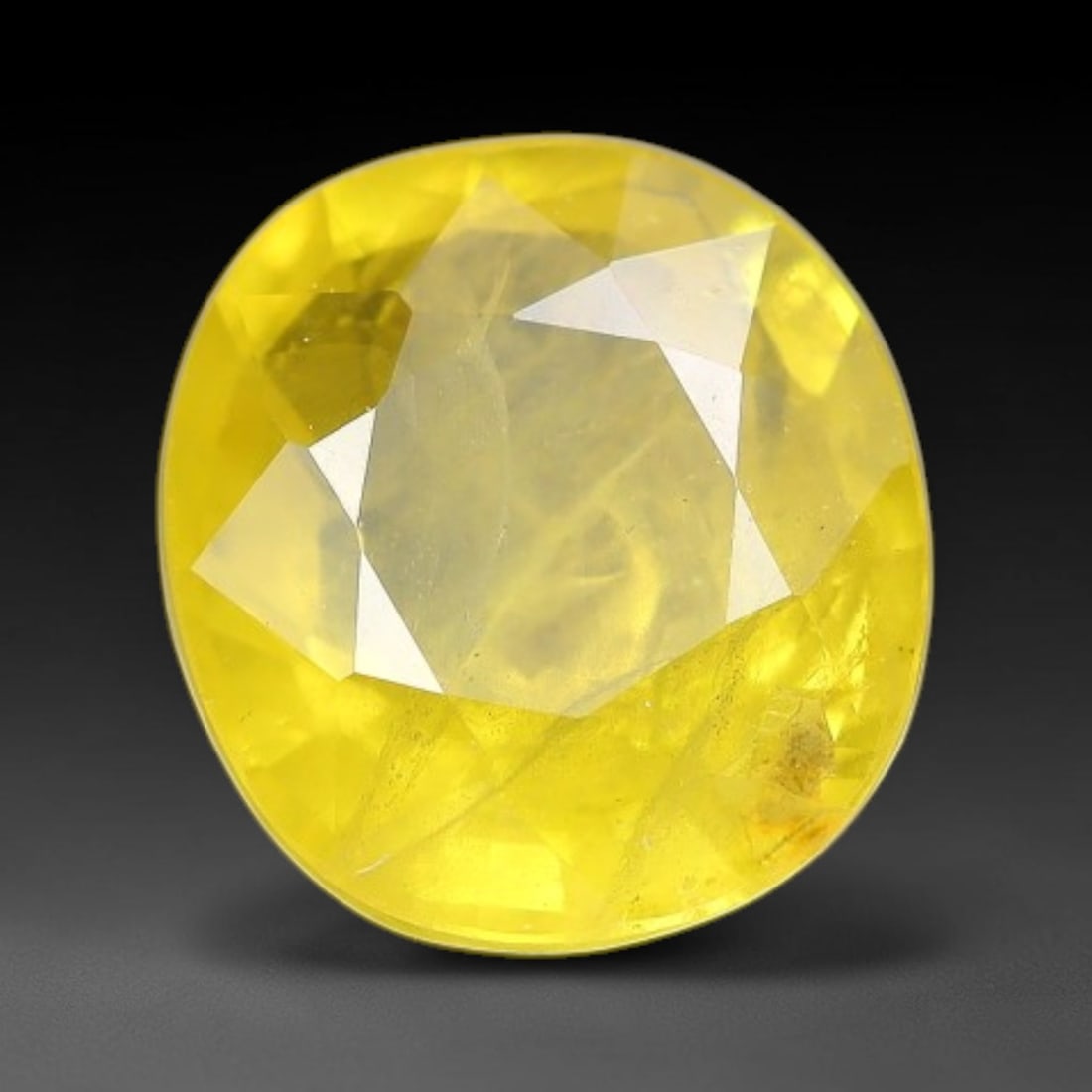 1.49 Carats Natural Yellow Sapphire Oval Faceted Loose Gemstone, 15TT: This natural yellow sapphire features a classic oval brilliant faceted cut, holding consistent warm golden-yellow color throughout the corundum crystal. Fine microscopic mineral specks and faint natur