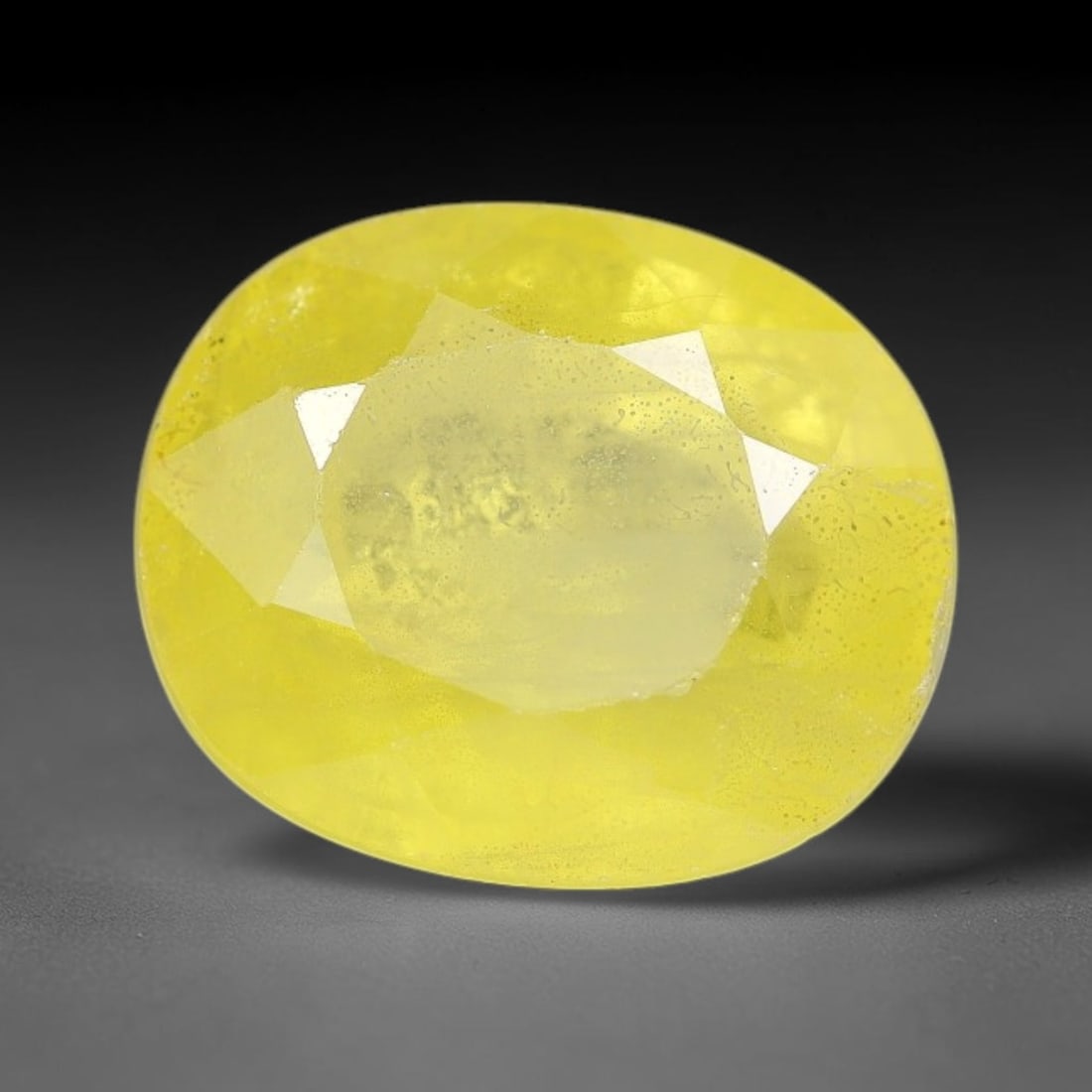 3.51 Carats Natural Yellow Sapphire Oval Faceted Loose Gemstone, 22TT: This natural yellow sapphire features a classic oval brilliant faceted cut, holding consistent warm golden-yellow color throughout the corundum crystal. Fine microscopic mineral specks and faint natur