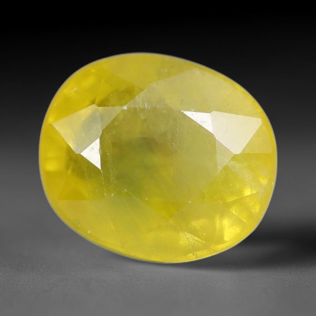3.04 Carats Natural Yellow Sapphire Oval Faceted Loose Gemstone, 29TT: This natural yellow sapphire features a classic oval brilliant faceted cut, holding consistent warm golden-yellow color throughout the corundum crystal. Fine microscopic mineral specks and faint natur