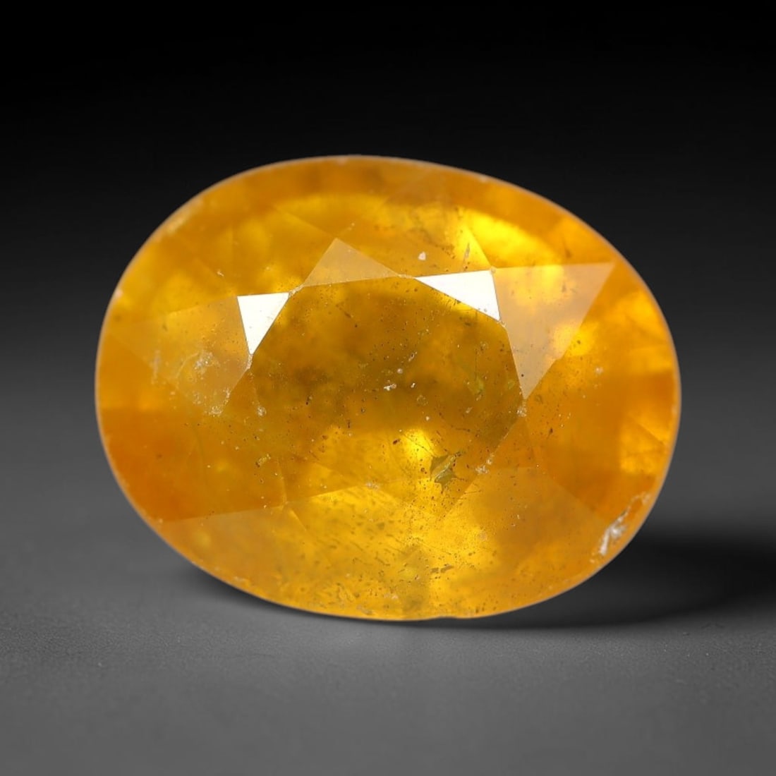 2.41 Carats Natural Yellow Sapphire Oval Faceted Loose Gemstone, 81TT: This natural yellow sapphire features a classic oval brilliant faceted cut, holding consistent warm golden-yellow color throughout the corundum crystal. Fine microscopic mineral specks and faint natur