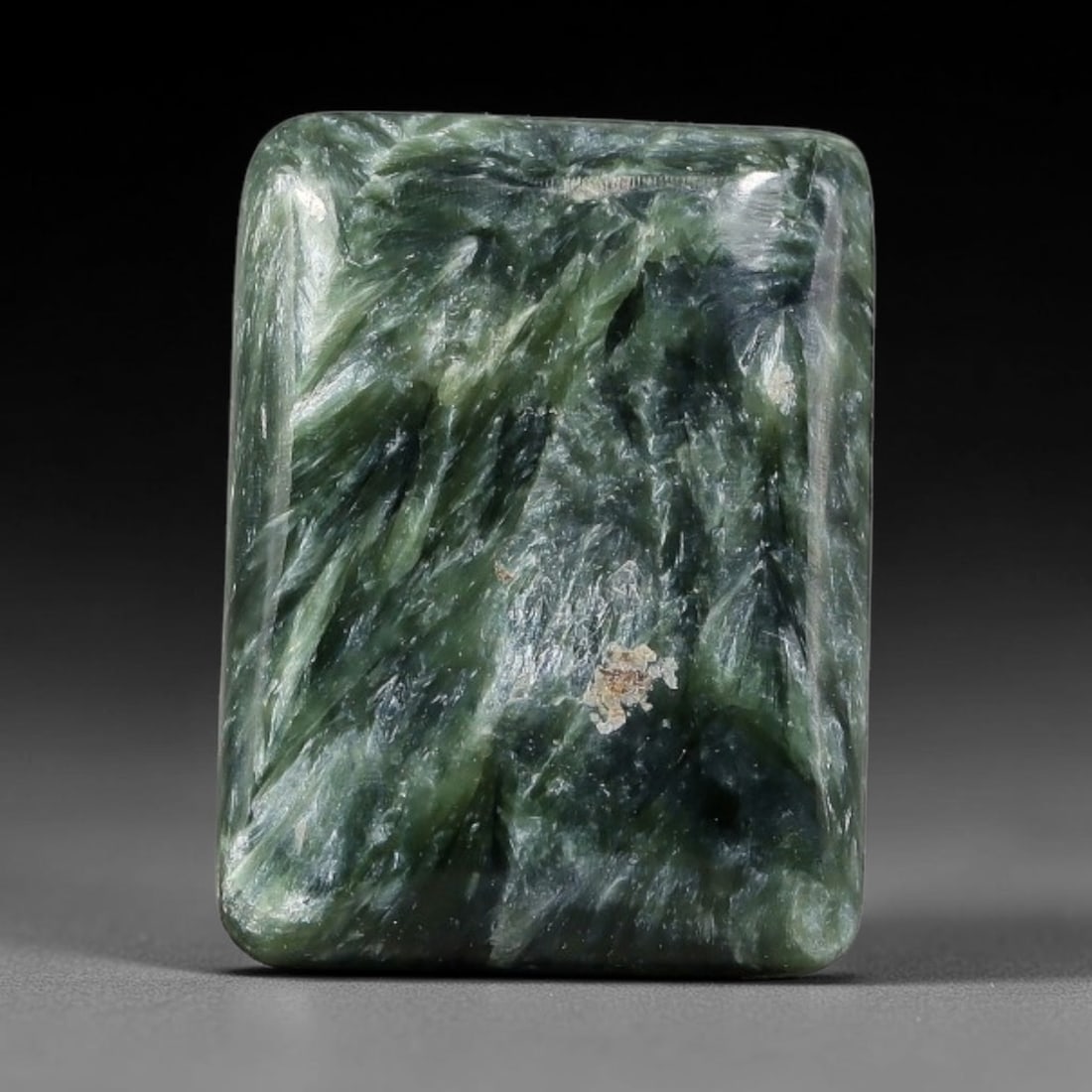 10.42 Carats Natural Deep Green Siberian Seraphinite Polished Cabochon, 71TZ: This is a fully natural polished seraphinite specimen sourced from Siberian deposits, displaying distinct feathery fibrous inclusions that create beautiful flowing chatoyant patterns across its smooth
