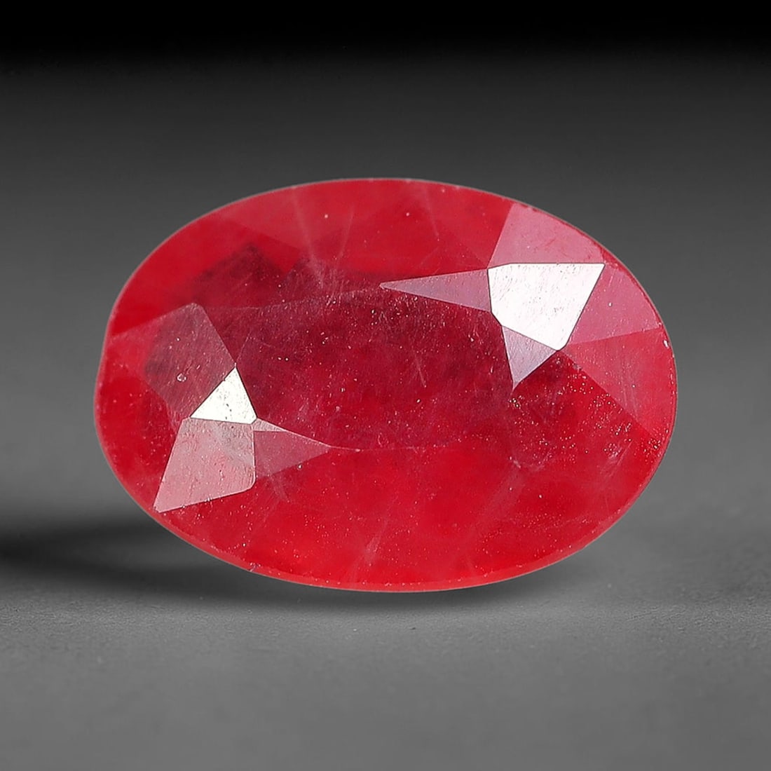 0.96 Carats Natural Orange Sapphire Oval Faceted Loose Gemstone, 76YW: This natural orange sapphire is fashioned in a classic oval brilliant faceted cut, presenting soft warm orange hues consistent with natural corundum specimens. Fine scattered mineral specks and faint 