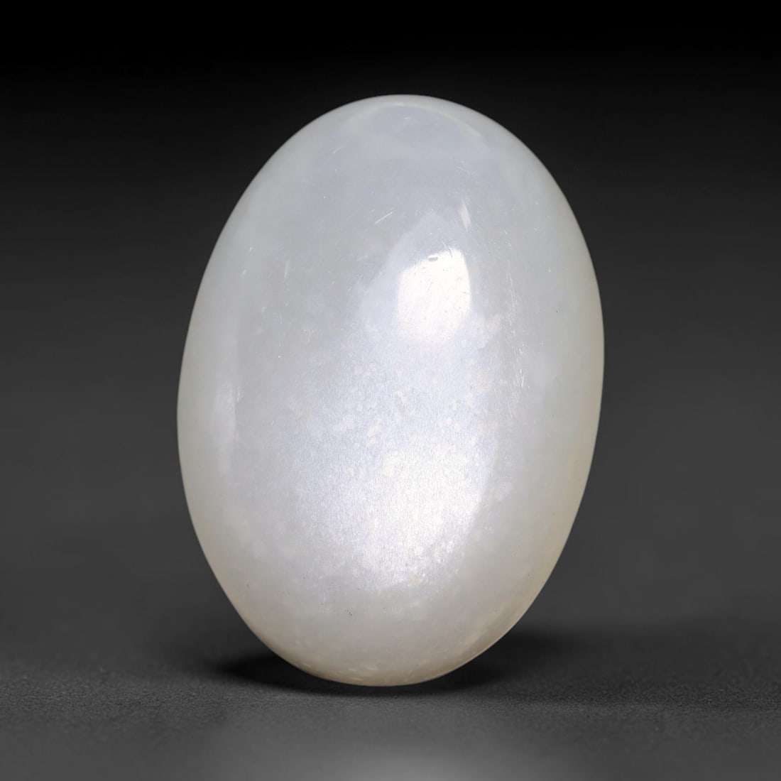 25.21 Carats Natural Ceylon White Moonstone Loose Gemstone, 63TM: This natural Ceylon white moonstone holds dimensions of 23.8x16.9x8.4mm, a well-polished natural feldspar gemstone sourced from Ceylon's renowned moonstone mineral deposits famous for distinctive ligh