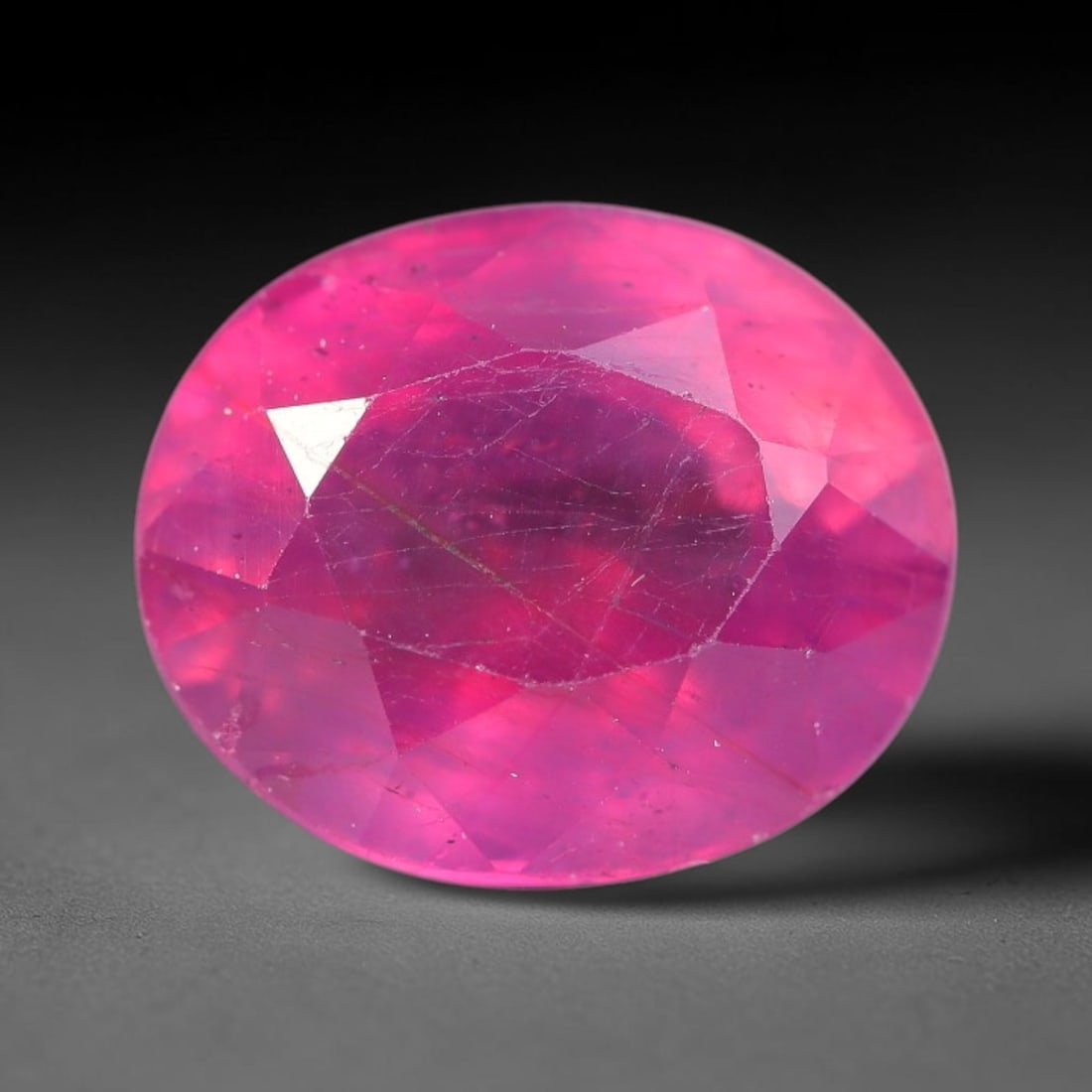4.65 Carats Natural Mozambique Ruby Oval Faceted Loose Gemstone, 20SA: This natural Mozambique ruby is fashioned with standard oval brilliant faceting, displaying vivid saturated crimson-red hue accompanied by native fine mineral inclusions and subtle trace marks inheren