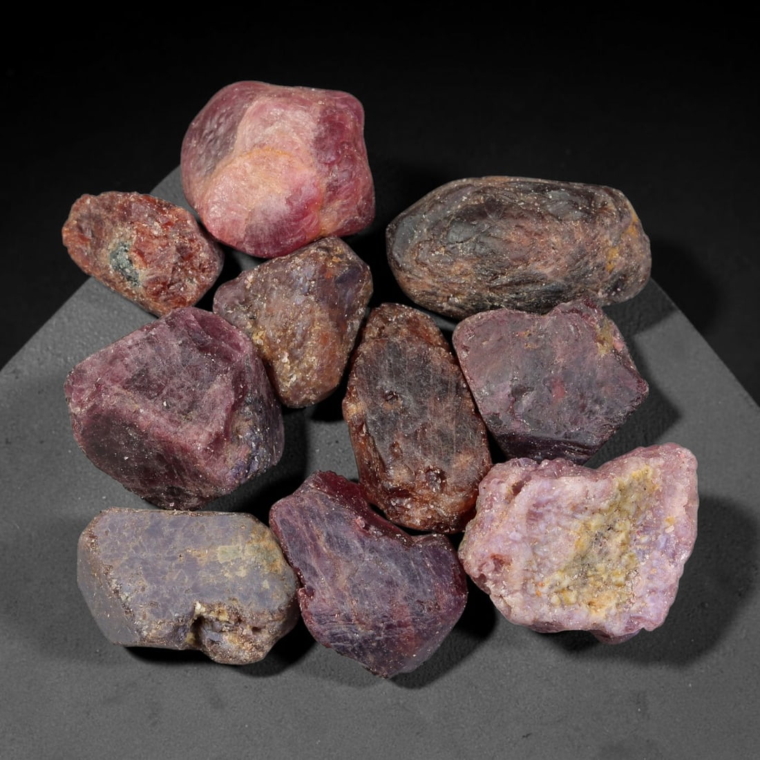 196.41ct Natural Spinel Rough Gemstone Parcel, Raw Spinel Crystals, 52TV: Natural spinel rough parcel with largest specimen measuring 21.7x13.7x9.4mm. Raw unpolished spinel crystals showing varied tones of red, pink, purple and grey, featuring natural crystalline textures, 