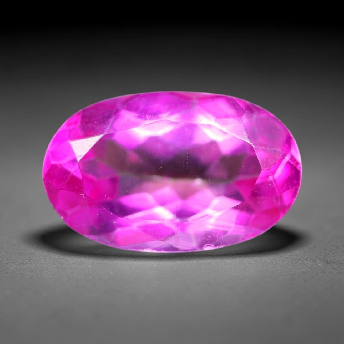 4.77 Carats Natural Brazilian Pink Topaz Oval Faceted Loose Gemstone, 87SA: This specimen is composed of natural topaz sourced from Brazilian mineral deposits, processed via professional faceted lapidary techniques with consistent glossy polishing applied to the entire crysta