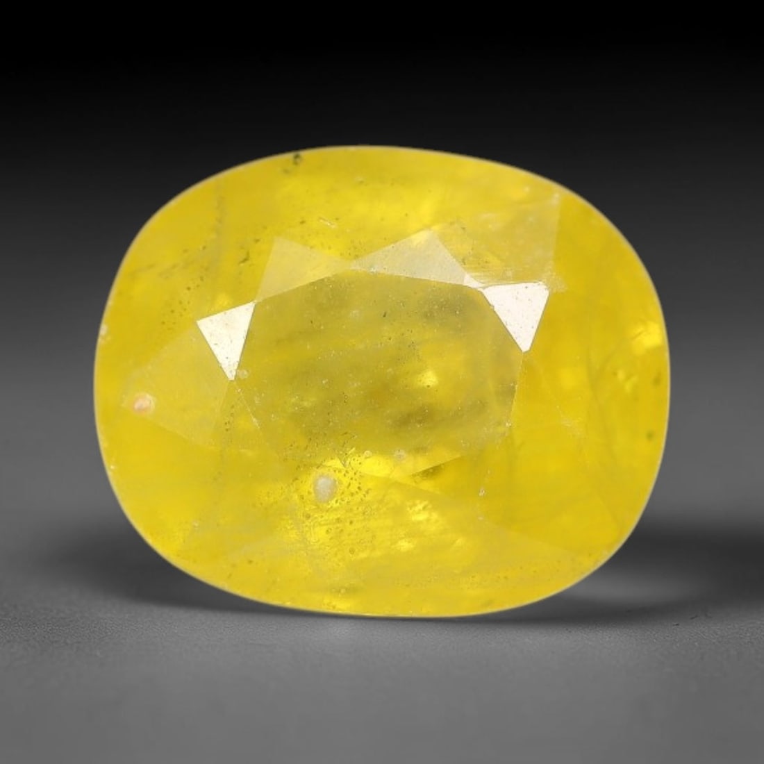 2.95 Carats Natural Yellow Sapphire Oval Faceted Loose Gemstone, 21TT: This natural yellow sapphire features a classic oval brilliant faceted cut, holding consistent warm golden-yellow color throughout the corundum crystal. Fine microscopic mineral specks and faint natur