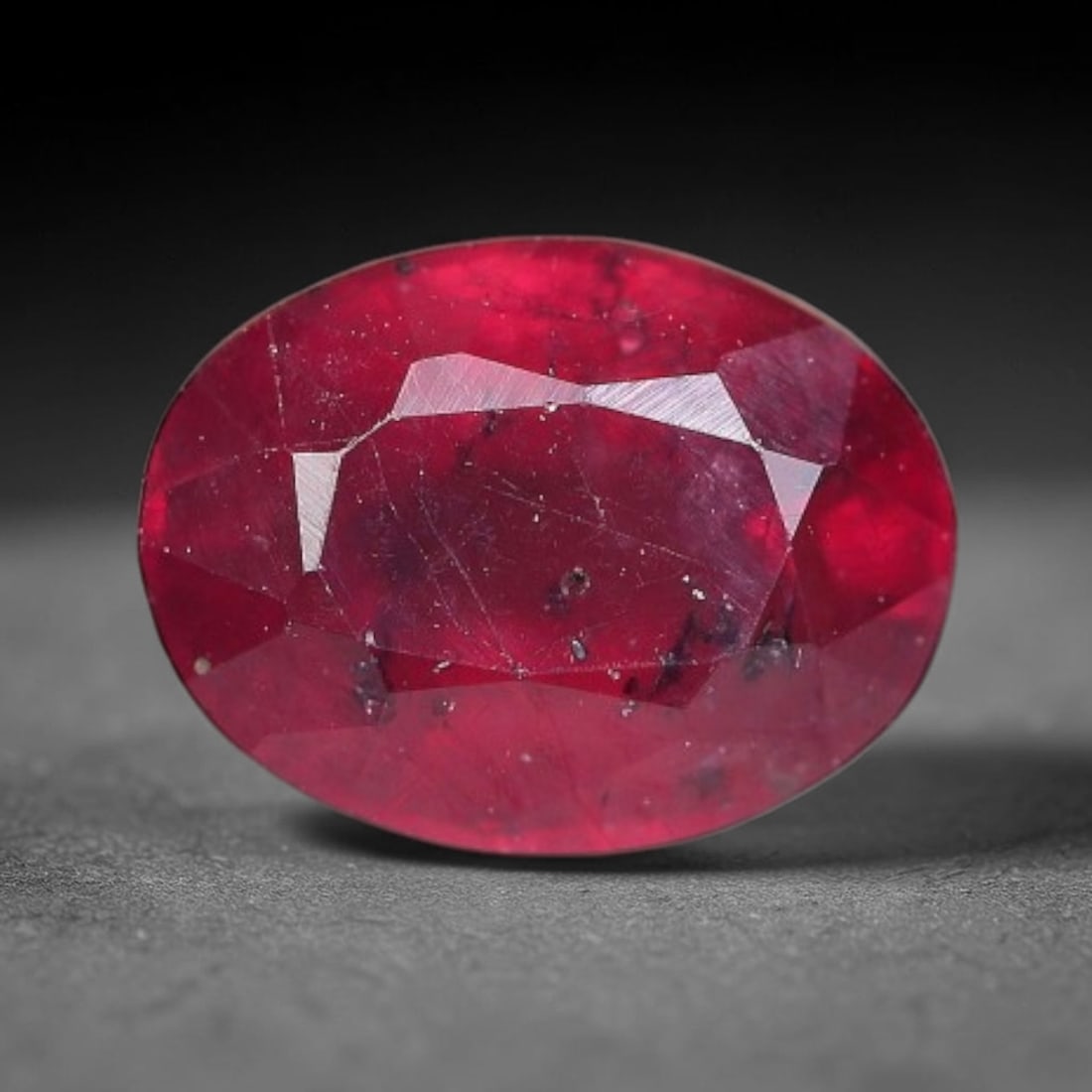 1.81 Carats Natural Mozambique Ruby Oval Faceted Loose Gemstone, 76TY: This natural Mozambique ruby is fashioned with standard oval brilliant faceting, displaying vivid saturated crimson-red hue accompanied by native fine mineral inclusions and subtle trace marks inheren