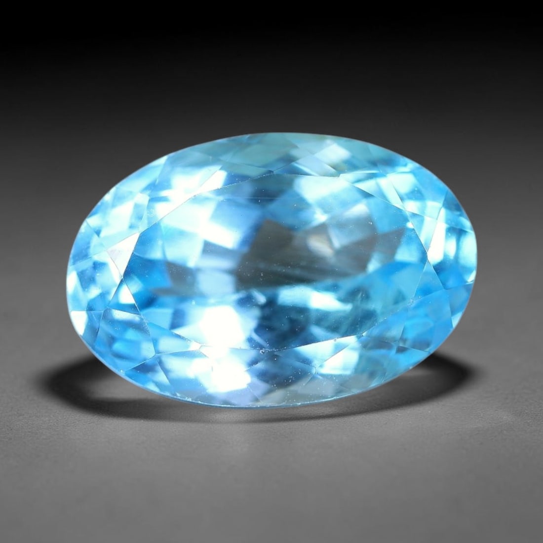 16.20 Carats Natural Brazilian Sky Blue Topaz Oval Faceted Loose Gemstone, 30YW: Constructed from genuine natural topaz sourced from Brazilian mineral deposits, the raw material has been refined through professional faceted lapidary processing with consistent glossy polishing acro