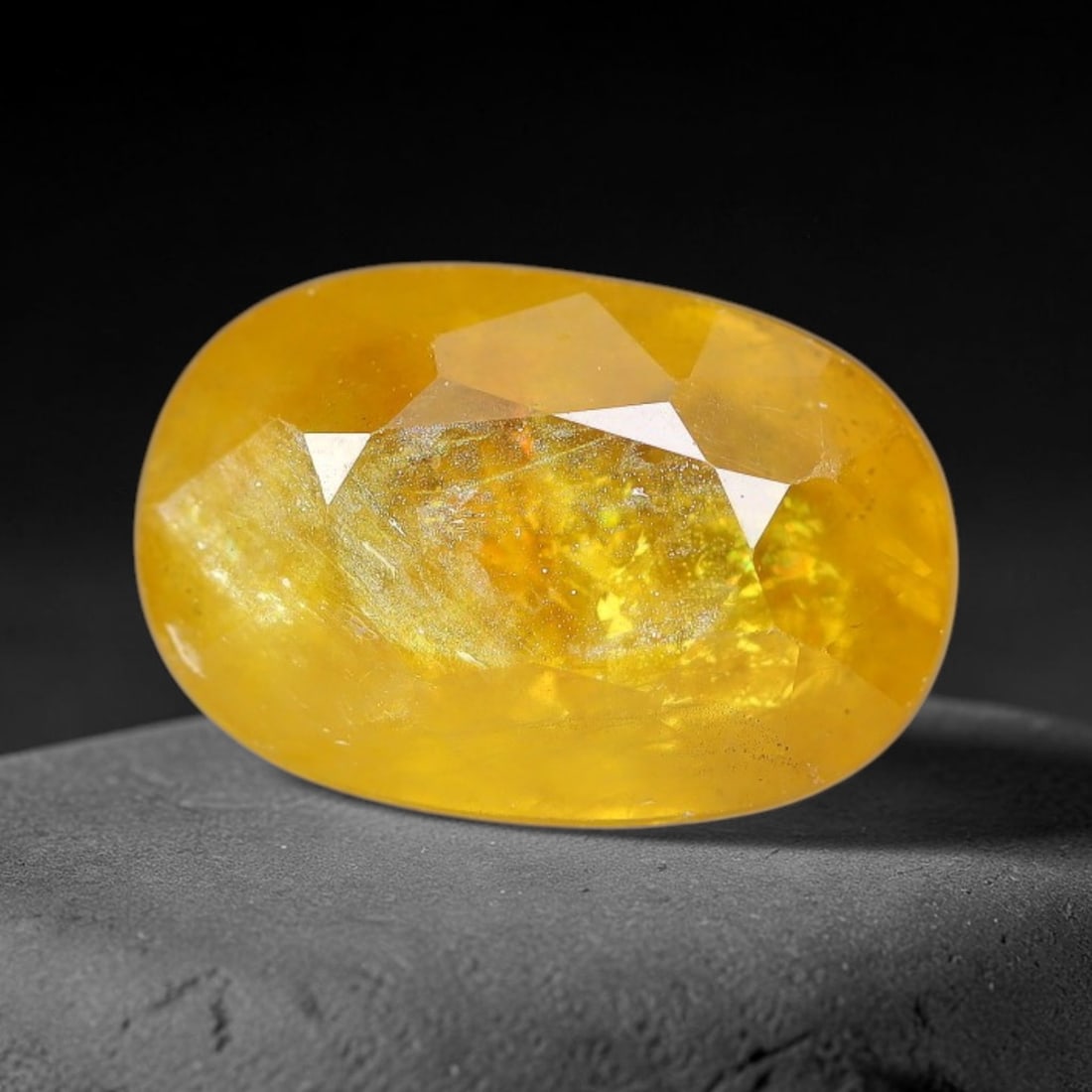 3.86 Carats Natural Yellow Sapphire Oval Faceted Loose Gemstone, 39TT: This natural yellow sapphire features a classic oval brilliant faceted cut, holding consistent warm golden-yellow color throughout the corundum crystal. Fine microscopic mineral specks and faint natur
