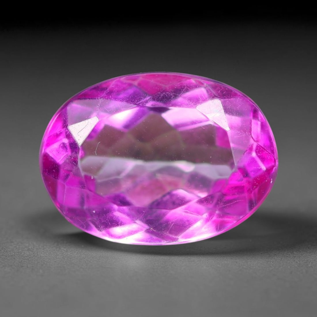 5.03 Carats Natural Brazilian Pink Topaz Oval Faceted Loose Gemstone, 98SA: This specimen is composed of natural topaz sourced from Brazilian mineral deposits, processed via professional faceted lapidary techniques with consistent glossy polishing applied to the entire crysta