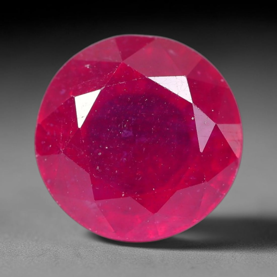 4.10 Carats Natural Mozambique Ruby Round Faceted Loose Gemstone, 12SA: This natural Mozambique ruby is fashioned with standard round brilliant faceting, displaying vivid saturated crimson-red hue accompanied by native fine mineral inclusions and subtle trace marks inhere