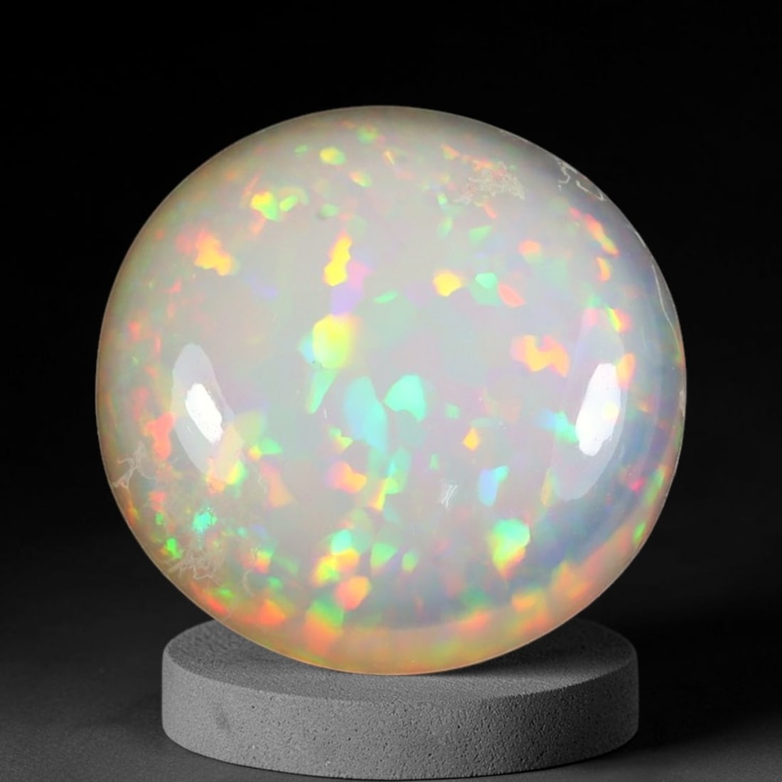 12.78ct Natural Multicolor Fire Ethiopian Welo Solid Opal Cabochon, 62TY: Formed from natural silica deposits within Ethiopian mineral veins, this solid opal cabochon features a smooth polished domed surface that highlights its natural light diffraction properties. Bright m