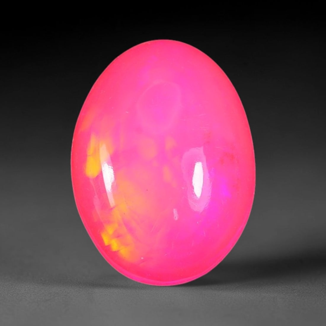 2.25ct Natural Ethiopian Welo Pink Fire Opal Cabochon Loose Gemstone, 80TS: This opal is sourced from Ethiopian Welo natural opal deposits and shaped into a smooth polished cabochon form with refined lapidary finishing work. Bright warm pink base accompanied by vivid internal