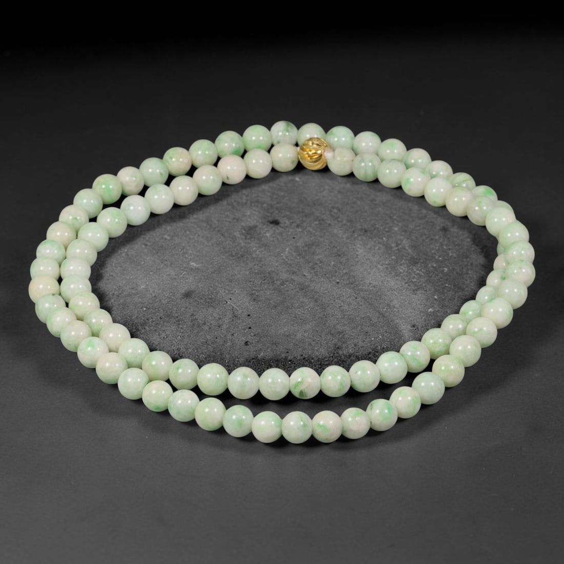 Natural Burmese Type A Floating Green Jadeite Jade Beaded Necklace, 22TF: This necklace is composed of smoothly polished round natural Burmese Type A jadeite beads measuring 6.8mm, with pale milky white base adorned with soft scattered floating green mottling. It is finishe