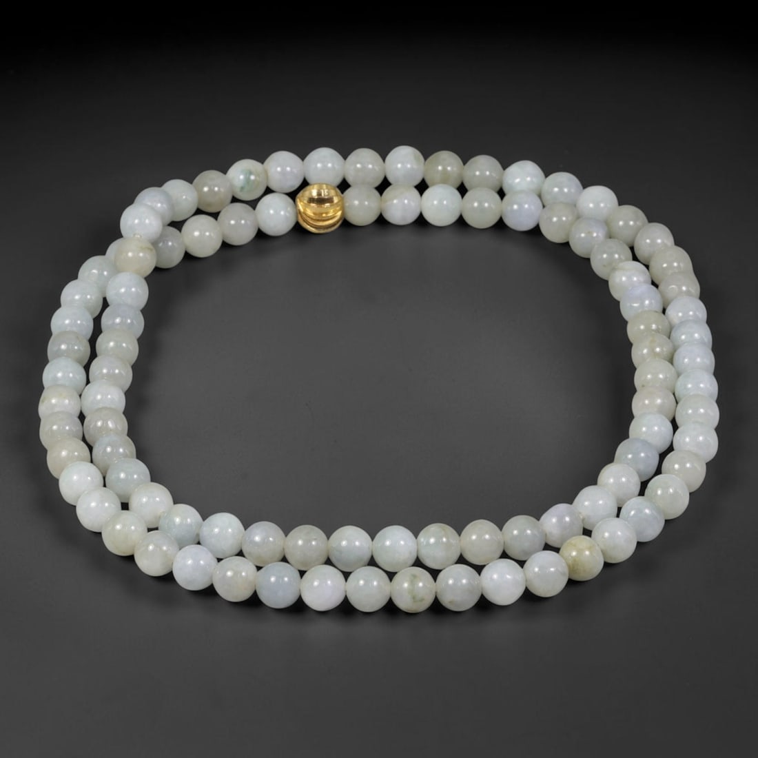 Natural Burmese Type A Pale Mottled Jadeite Jade Beaded Necklace, 20TF: This necklace consists of smoothly polished round natural Burmese Type A jadeite beads measuring 6.5mm, featuring milky white base with faint soft green mottling and subtle natural inclusions. It is f
