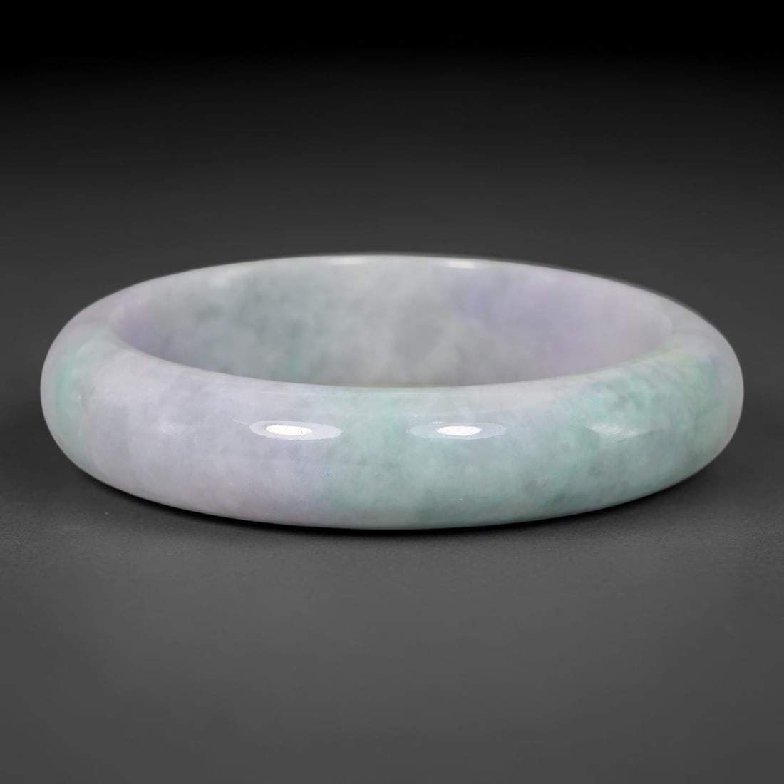Natural Burmese Type A Lavender Mottled Floating Green Jadeite Jade Bangle Bracelet, 33TD: This thick band bangle is made from natural Burmese Type A jadeite. The stone displays a pale lavender base blended with soft mottled floating green clouding across the surface. The bangle features a 