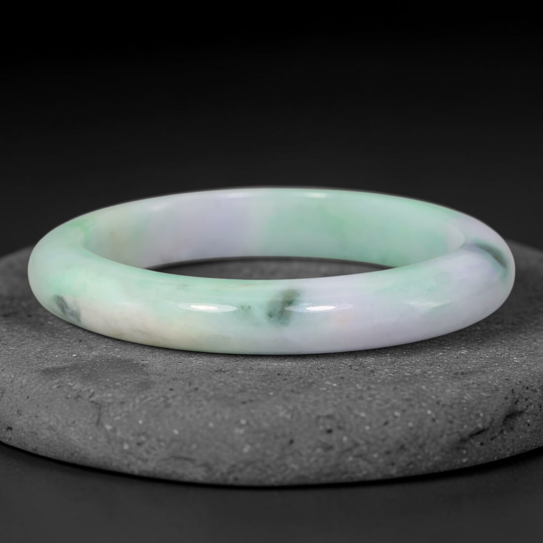 Natural Burmese Type A Lavender Pale Green Floating Jadeite Jade Bangle Bracelet, 27TD: This slender band bangle is crafted from natural Burmese Type A jadeite. The stone features a gentle blend of pale lavender and soft mint green, accented by isolated dark green floating mineral speckl