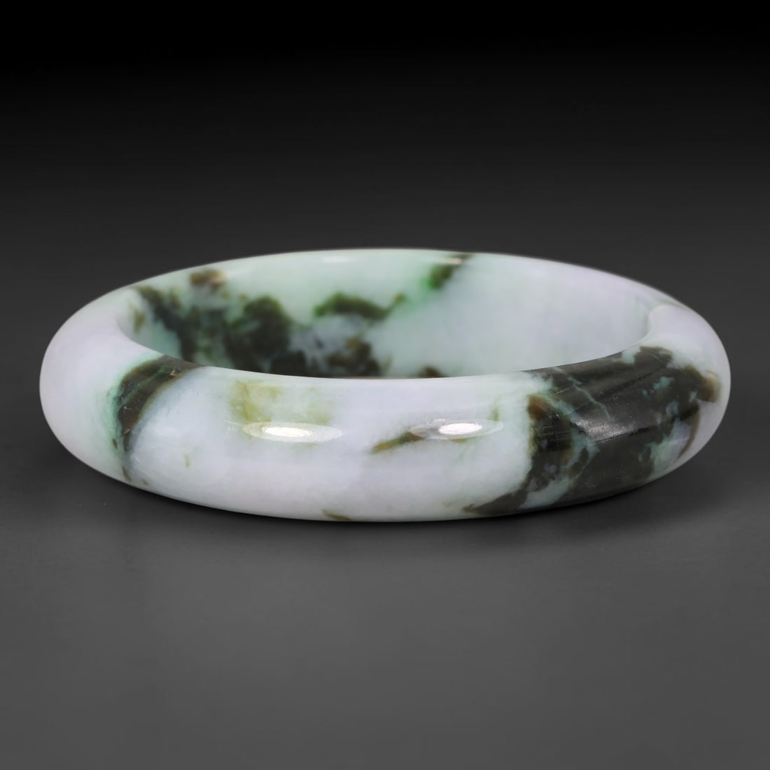 Natural Burmese Type A Dark Mottled Floating Green Jadeite Jade Bangle Bracelet, 21TD: This thick wide band bangle is crafted from natural Burmese Type A jadeite. The stone has a creamy pale white base interspersed with bold dark green and brownish mineral mottling forming organic cloud
