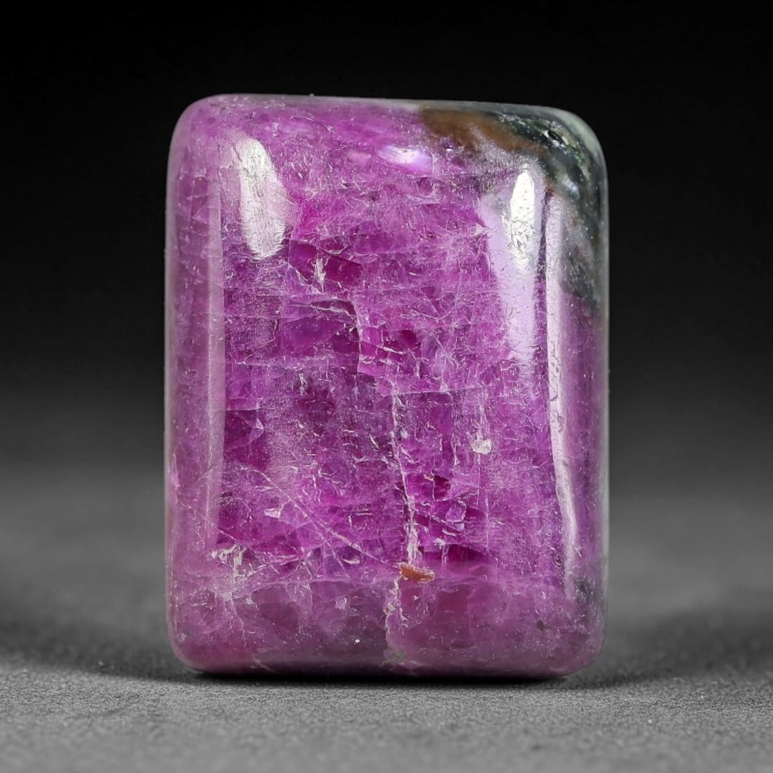 21.51ct Natural Ruby Zoisite Cabochon Loose Gemstone, 98TZ: Natural ruby zoisite cabochon cut, dimensions 17.3x13.3x6.3mm. Rich magenta and deep purple swirling colour pattern with natural mineral veining across the polished surface. Smooth polished cabochon f