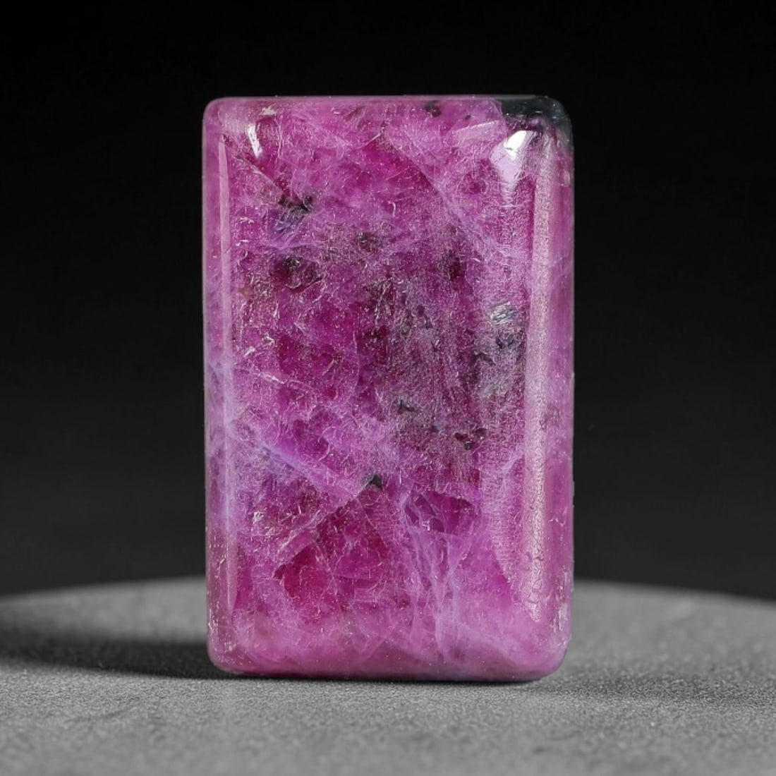 8.89ct Natural Ruby Zoisite Cabochon Loose Gemstone, 95TZ: Natural ruby zoisite cabochon cut, dimensions 15.6x9.9x3.9mm. Rich magenta and deep purple swirling colour pattern with natural mineral veining across the polished surface. Smooth polished cabochon fi