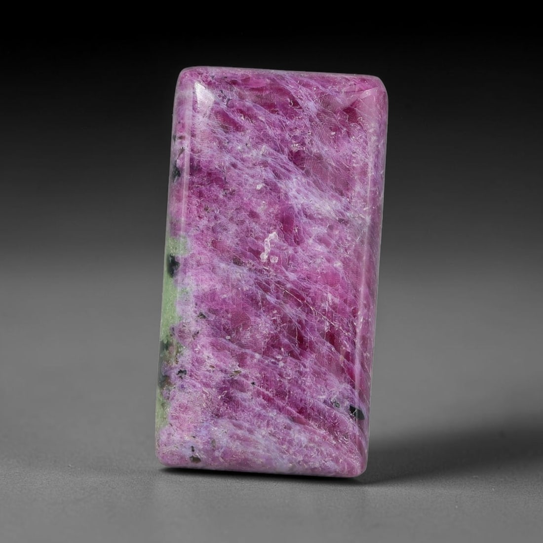 25.07ct Natural Ruby Zoisite Cabochon Loose Gemstone, 15TY: Natural ruby zoisite cabochon cut, dimensions 24.3x13.0x5.0mm. Rich magenta and deep purple swirling colour pattern with natural mineral veining across the polished surface. Smooth polished cabochon f