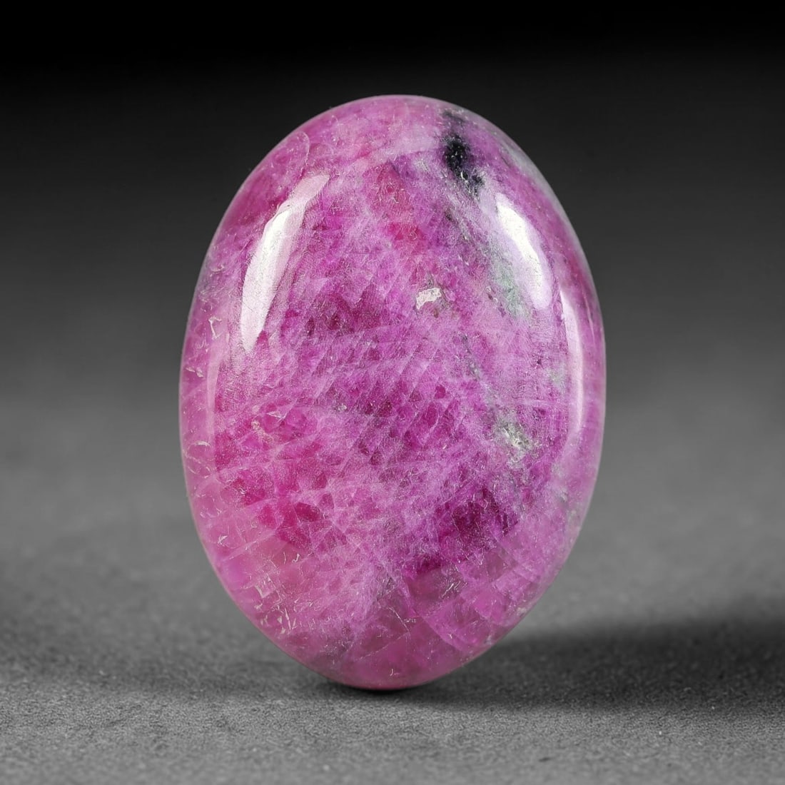 28.06ct Natural Ruby Zoisite Cabochon Loose Gemstone, 19TY: Natural ruby zoisite cabochon cut, dimensions 26.3x19.0x4.8mm. Rich magenta and deep purple swirling colour pattern with natural mineral veining across the polished surface. Smooth polished cabochon f