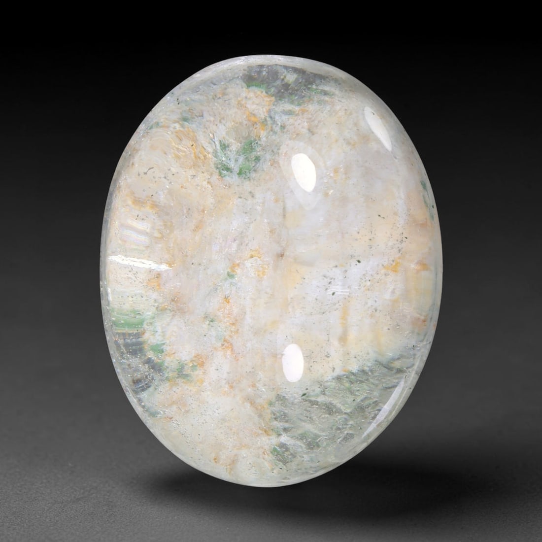 39.42ct Natural Brazilian Phantom Quartz Oval Cabochon Loose Gemstone, 49YX: This smoothly polished cabochon of natural phantom quartz preserves delicate layered phantom crystal formations enclosed inside transparent quartz host. The domed polished surface offers unobstructed 