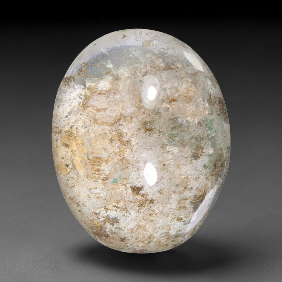 31.66ct Natural Brazilian Phantom Quartz Oval Cabochon Loose Gemstone, 32YX: This smoothly polished cabochon of natural phantom quartz preserves delicate layered phantom crystal formations enclosed inside transparent quartz host. The domed polished surface offers unobstructed 