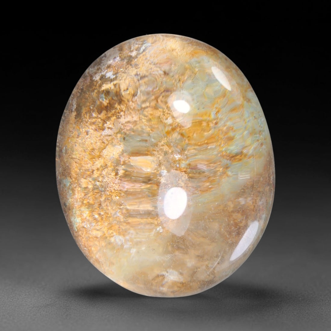 36.75ct Natural Brazilian Phantom Quartz Oval Cabochon Loose Gemstone, 59YX: This smoothly polished cabochon of natural phantom quartz preserves delicate layered phantom crystal formations enclosed inside transparent quartz host. The domed polished surface offers unobstructed 