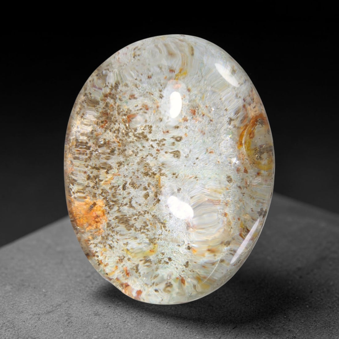 34.03ct Natural Brazilian Phantom Quartz Oval Cabochon Loose Gemstone, 50YX: This smoothly polished cabochon of natural phantom quartz preserves delicate layered phantom crystal formations enclosed inside transparent quartz host. The domed polished surface offers unobstructed 