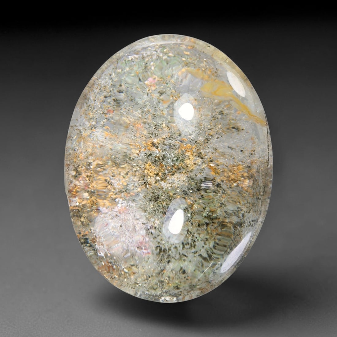 33.93ct Natural Brazilian Phantom Quartz Oval Cabochon Loose Gemstone, 56YX: This smoothly polished cabochon of natural phantom quartz preserves delicate layered phantom crystal formations enclosed inside transparent quartz host. The domed polished surface offers unobstructed 