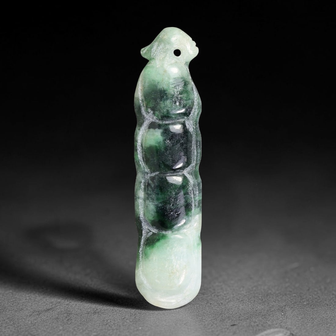 Natural Burmese Type A Jadeite Jade Hand Carved Pendant, 9TS: Artisan hand-carved untreated Burmese Type A jadeite jade pendant measuring 53.6x12.7 mm. Carefully sculpted with detailed relief craftsmanship and finished with a smooth glossy polish. Authentic Type