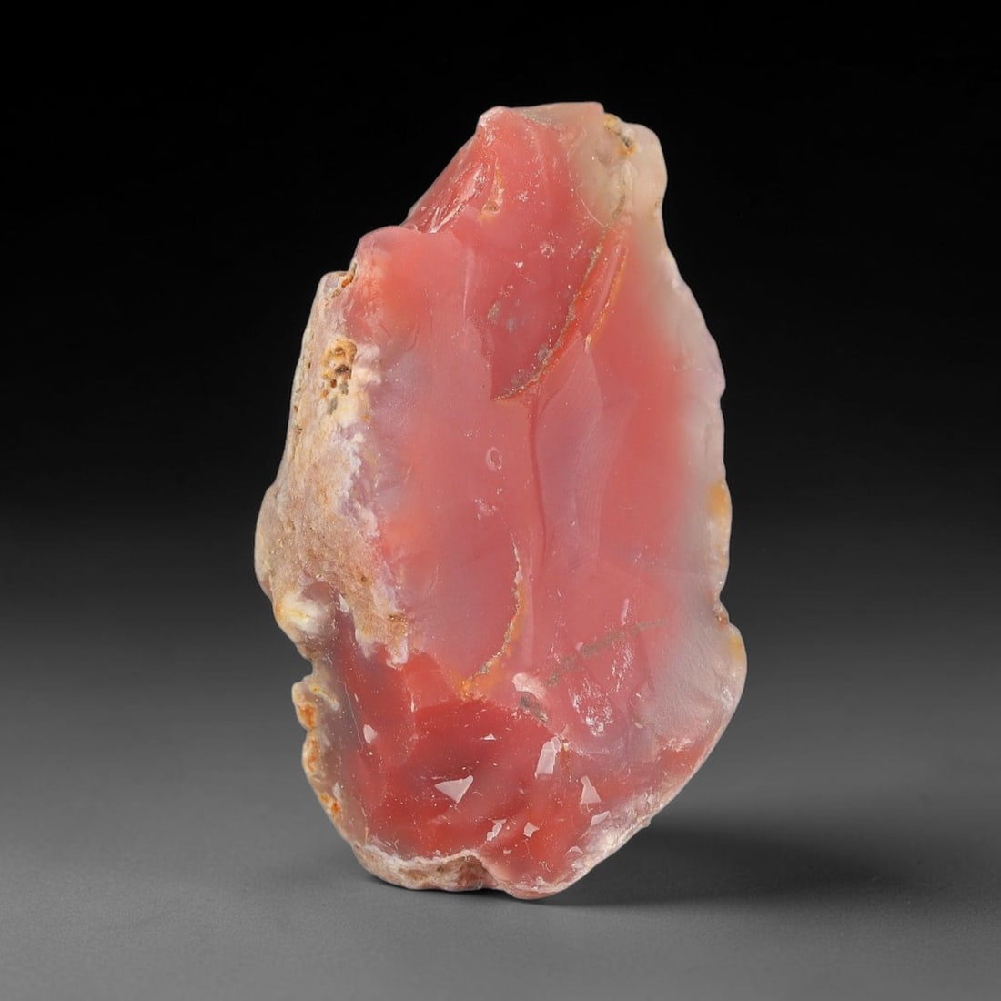 61g Natural Pink Red Agate Rough Loose Raw Gemstone Specimen, 39SB: This natural pink red agate rough weighs 61g, with dimensions 51.6x35.6x29.2mm. It displays beautiful translucent pink-red colour with smooth waxy texture, partial natural host rock rind along the edg