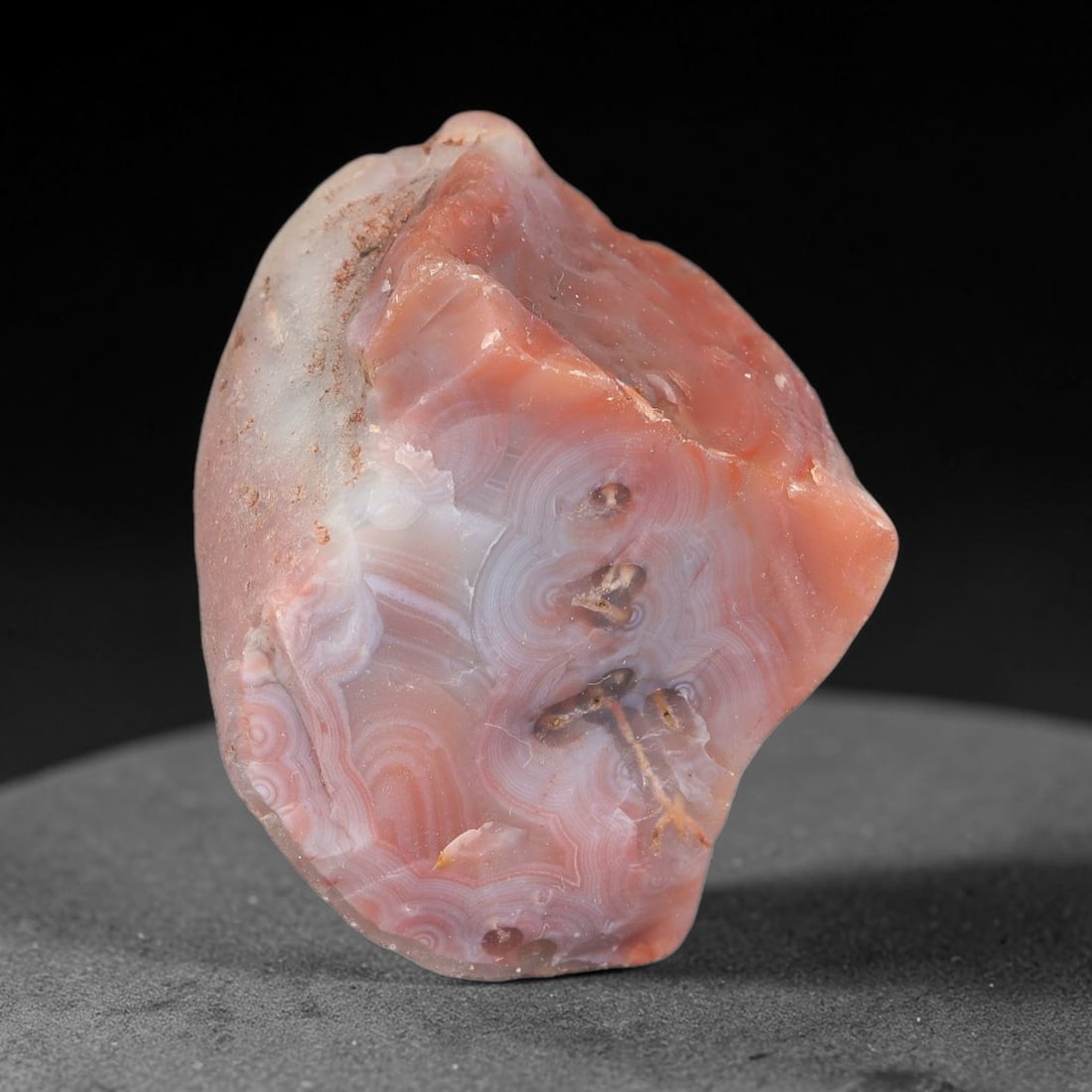 67g Natural Banded Pink Agate Rough Loose Raw Gemstone Specimen, 53SB: This natural banded pink agate rough weighs 67g, with dimensions 51.7x36.4x32.8mm. It shows stunning swirling pink and white banding patterns with translucent quality, natural cavities and outer matri