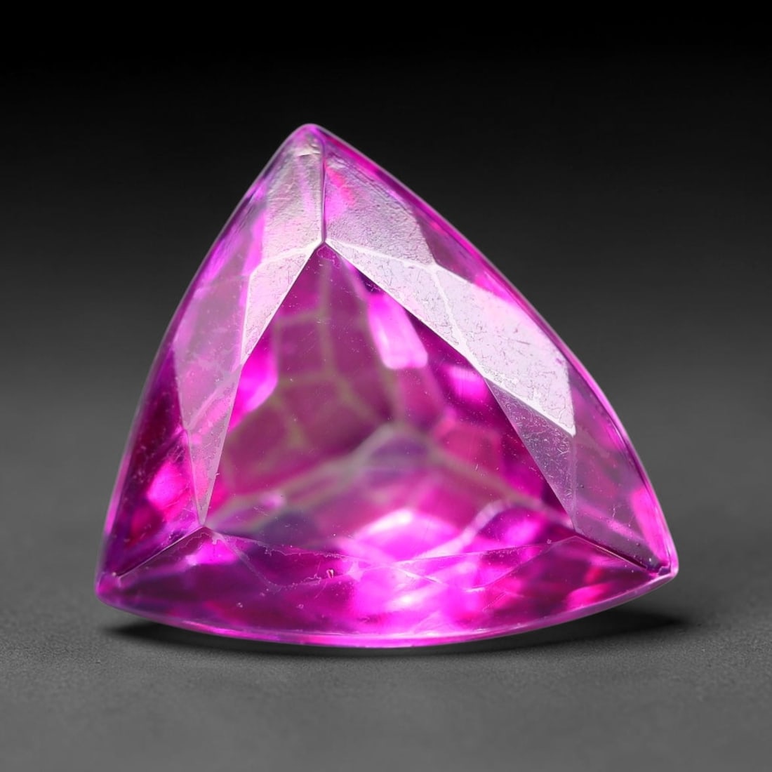 6.77 Carats Natural Brazilian Pink Topaz Trillion Faceted Loose Gemstone, 94SA: This specimen is composed of natural topaz sourced from Brazilian mineral deposits, processed via professional faceted lapidary techniques with consistent glossy polishing applied to the entire crysta
