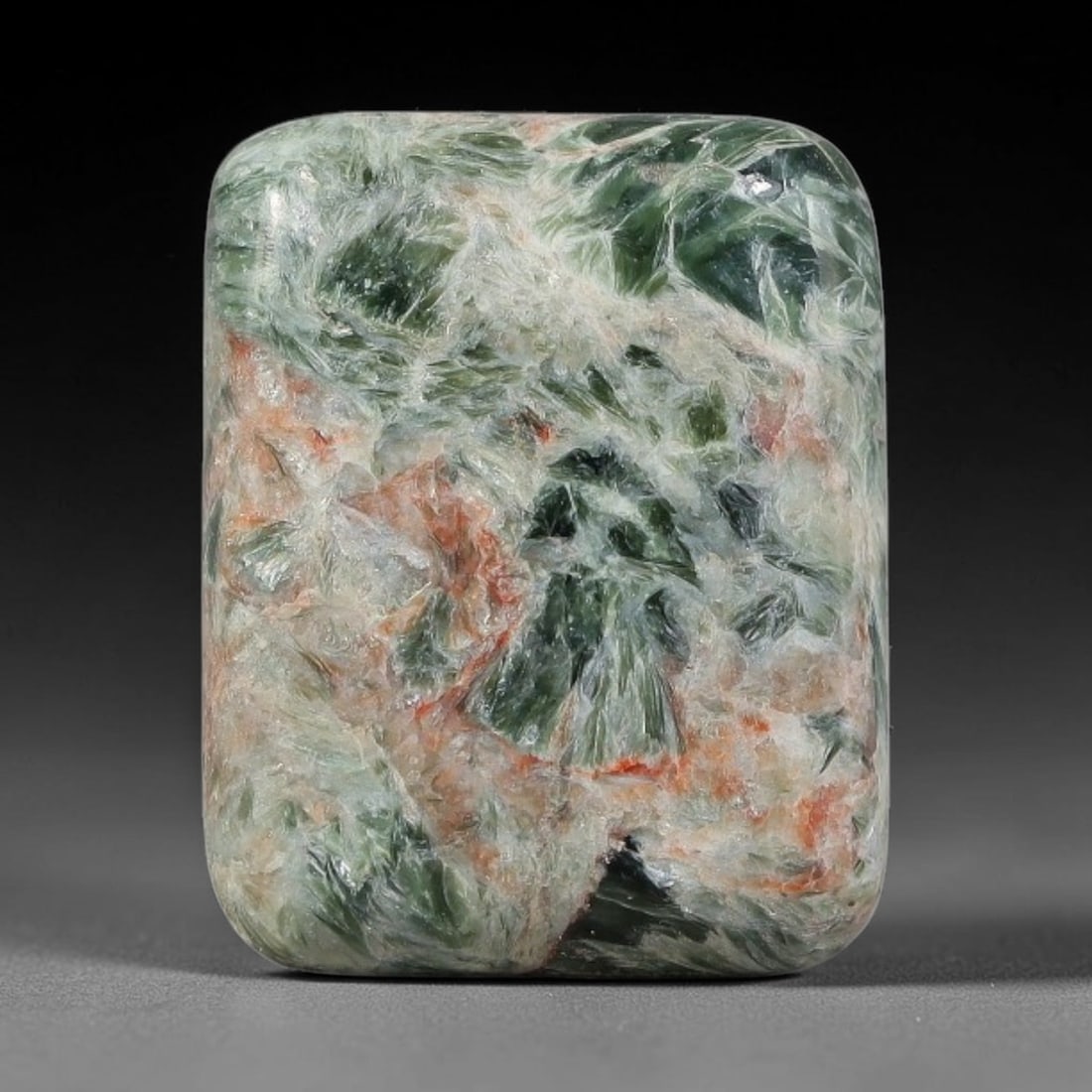 13.83 Carats Natural Deep Green Siberian Seraphinite Polished Cabochon, 67TZ: This is a fully natural polished seraphinite specimen sourced from Siberian deposits, displaying distinct feathery fibrous inclusions that create beautiful flowing chatoyant patterns across its smooth