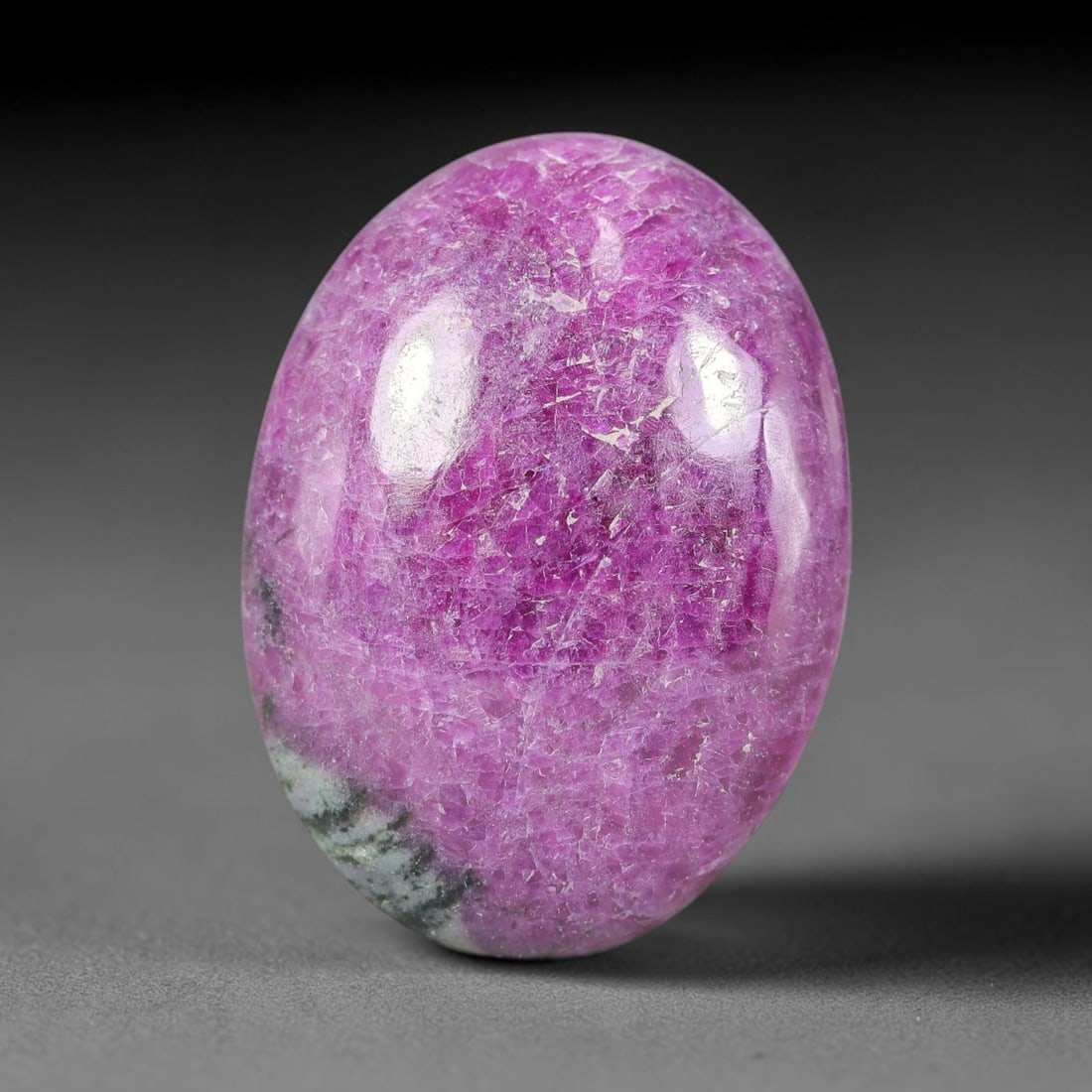 31.44ct Natural Ruby Zoisite Cabochon Loose Gemstone, 18TY: Natural ruby zoisite cabochon cut, dimensions 26.8x19.7x6.0mm. Rich magenta and deep purple swirling colour pattern with natural mineral veining across the polished surface. Smooth polished cabochon f
