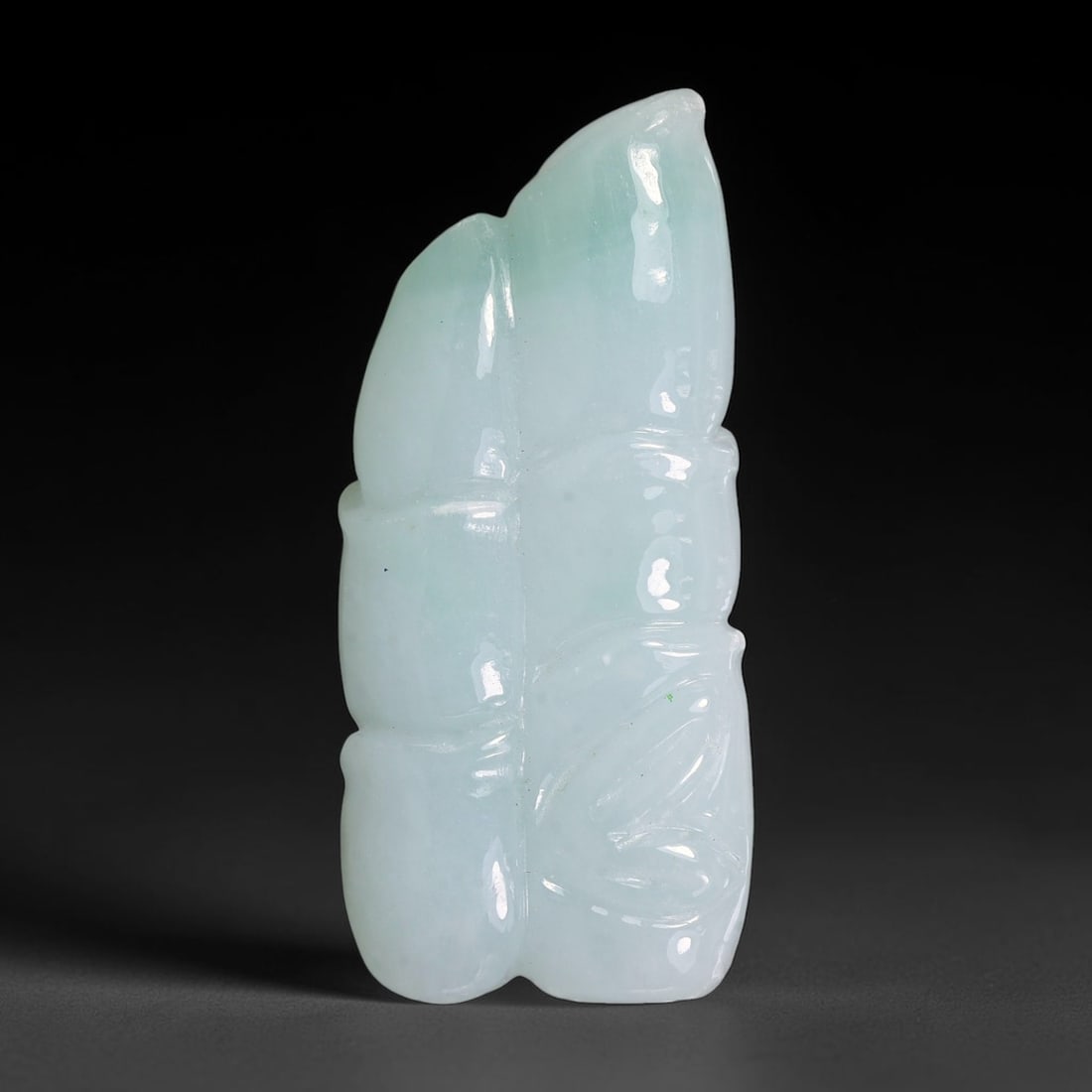 Natural Burmese Type A Jadeite Jade Hand Carved Pendant, 2TS: Artisan hand-carved untreated Burmese Type A jadeite jade pendant measuring 44.2x20.0 mm. Carefully sculpted with detailed relief craftsmanship and finished with a smooth glossy polish. Authentic Type