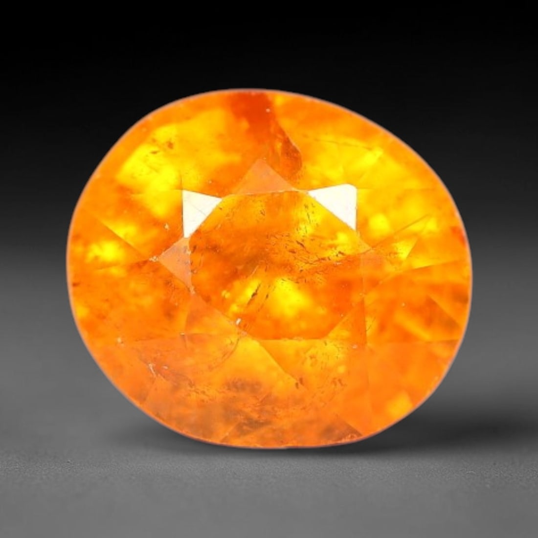 1.82ct Natural Orange Garnet Oval Cut Loose Gemstone, 63SE: Natural orange garnet, dimensions 7.2x6.0x4.9mm, oval faceted cut. Vibrant warm orange hue with natural inclusions. Ideal for custom ring, pendant and jewelry setting. Untreated natural gemstone ready