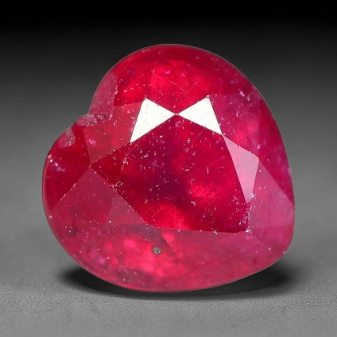 3.16 Carats Natural Madagascar Ruby Heart Faceted Loose Gemstone, 80SC: This sizable natural Madagascar ruby is cut into an heart brilliant faceted form, showcasing rich saturated crimson red hue characteristic of Malagasy corundum. Extensive natural internal silk veining