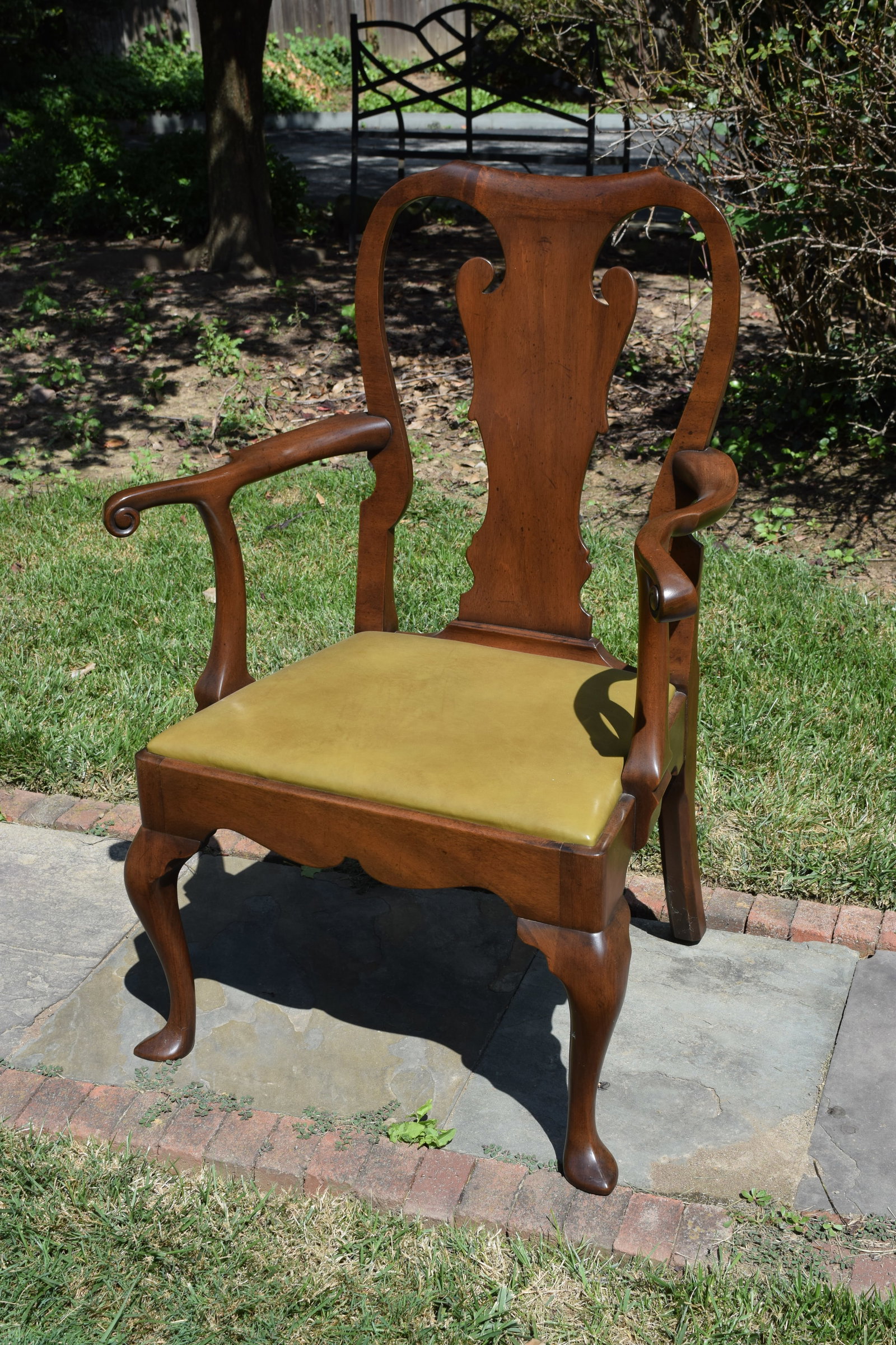 Kittinger Colonial Williamsburg CW-151 Armchair: Hand-carved and hand-finished. Solid contoured back splat, cabriole legs, leather seat and scroll arms.The original in which this chair has been reproduced was circa 1740, Queen Anne (George II)