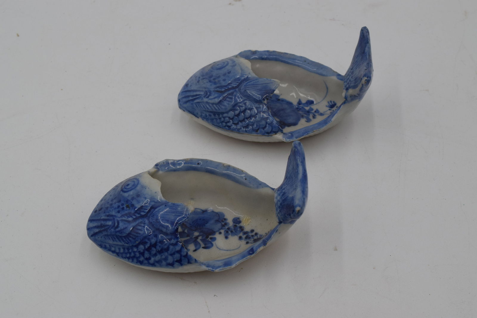 Early Canton Chinese Fish Bone Dishes (2 pc): Used for collecting bones or for serving sauces. Fish scale pattern on bottom. features the customary Chinese Pagoda, Pine Tree, Bridge & Stream normally found in the Blue Willow Pattern.
