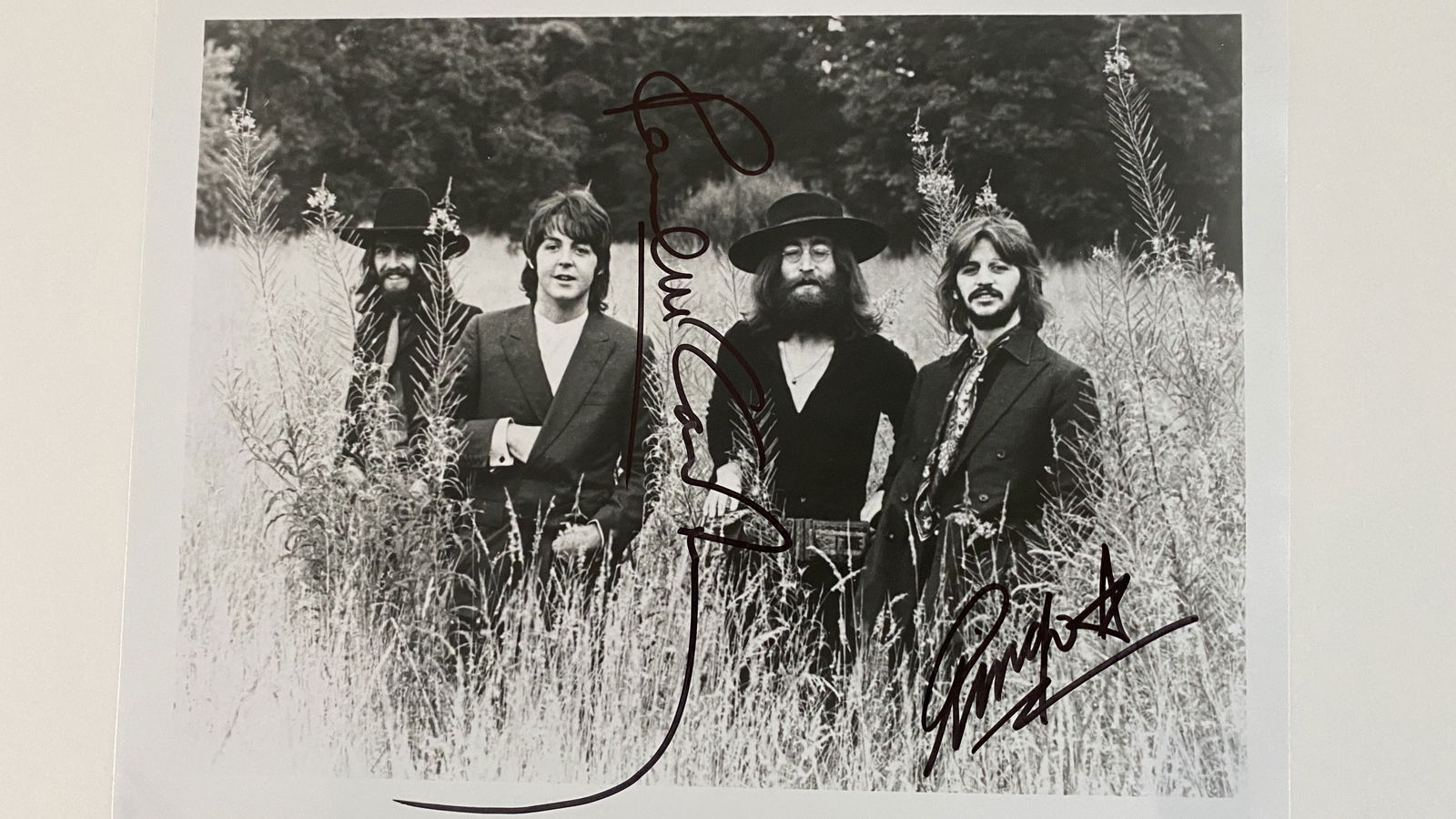 The Beatles rare band photo. GFA Authenticated: The Beatles rare band photo autographed by Paul McCartney and Ringo Starr. 8x10 inches. GFA Authenticated