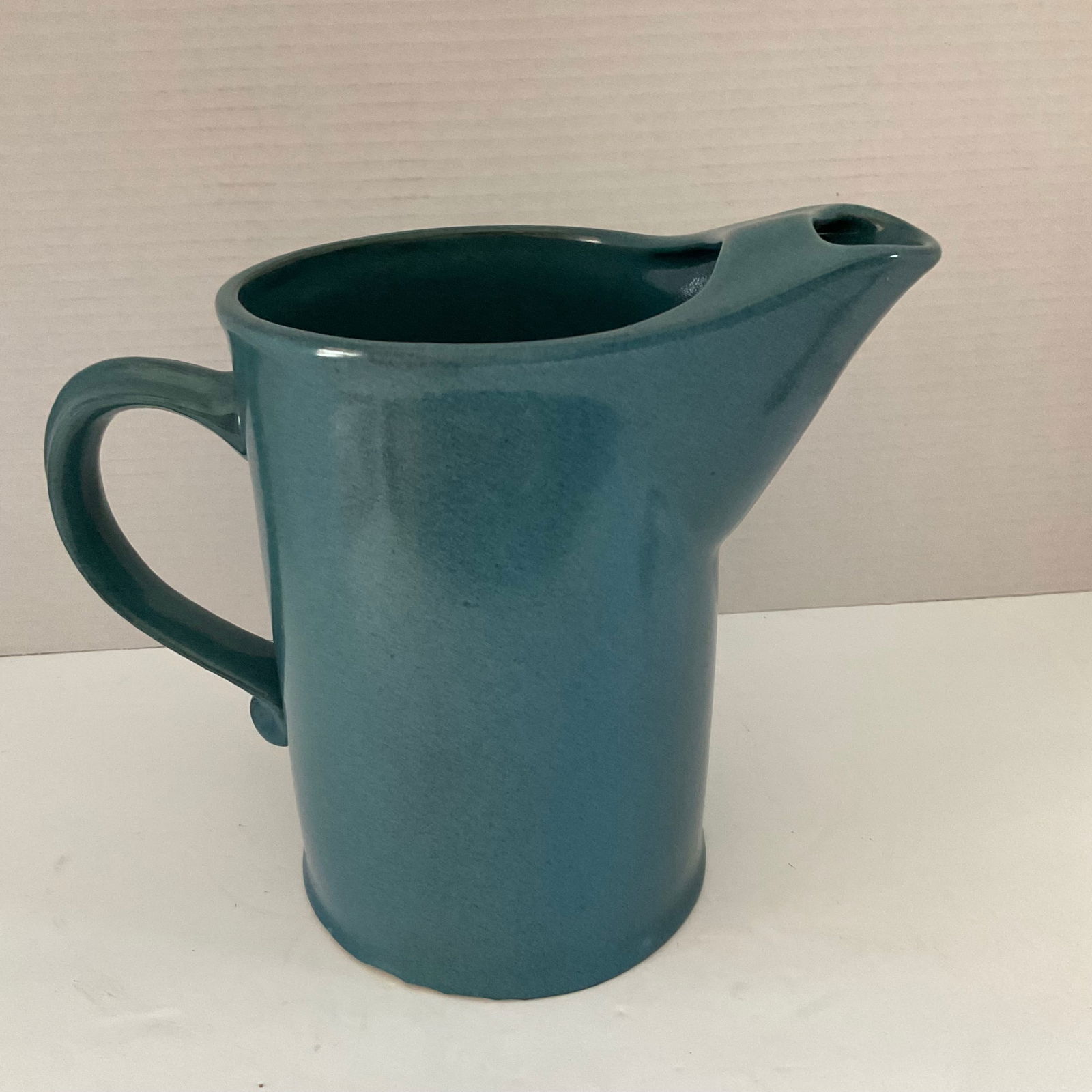 Bennington Pottery David Gil Pitcher Mid Century: A vintage mid century David Gil Design 9" pitcher from Bennington Pottery. This piece does have a few chips at the base as shown in the photos, otherwise very good conditon. Lovely blue color with min