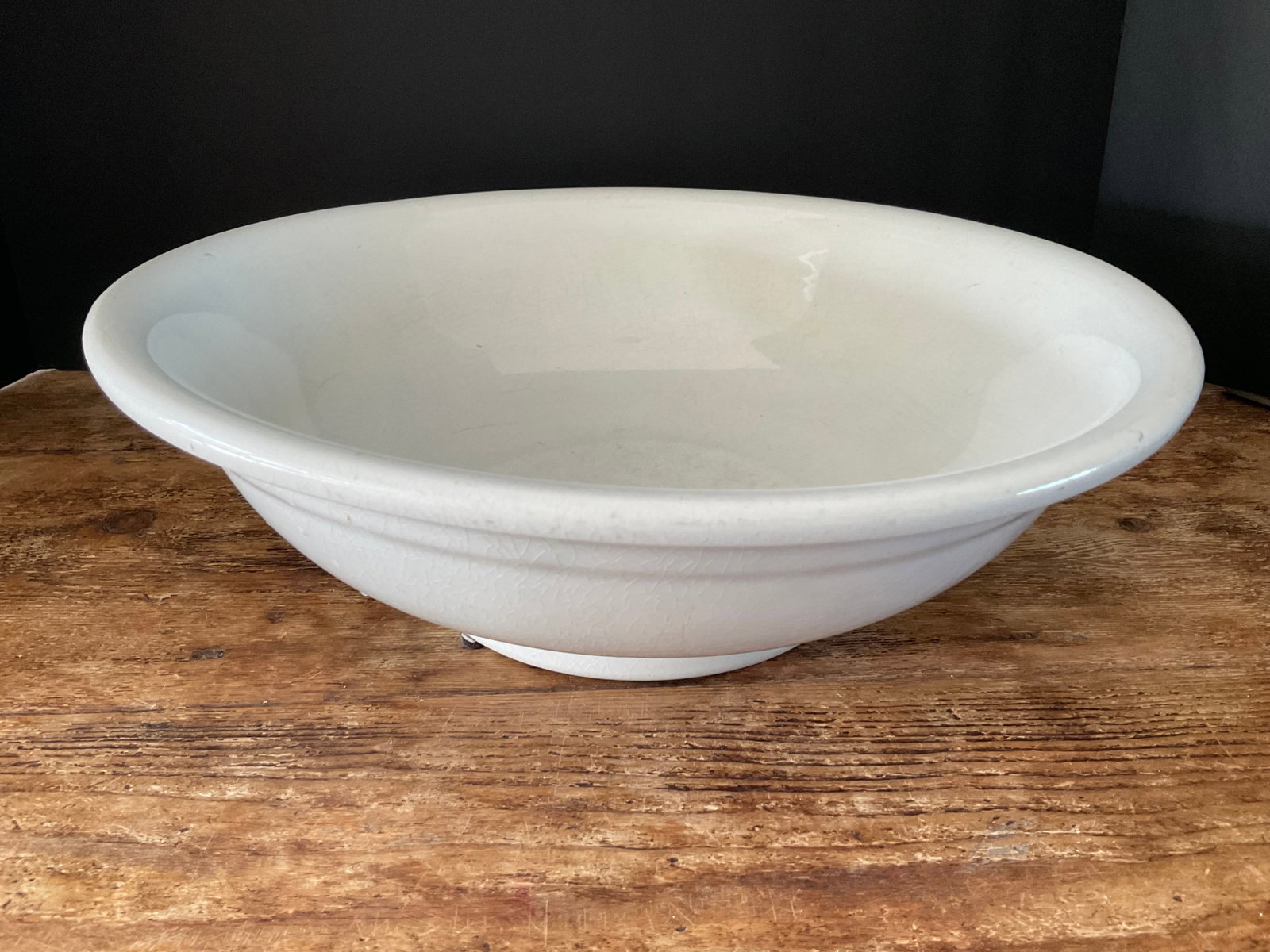 Antique White Cook & Hancock Bowl: Antique white ironstone bowl. The bowl diameter is 14" and the height is 5". No chips or cracks, small inclusion that looks like it was there when the piece was fired. some crazing consistent with age