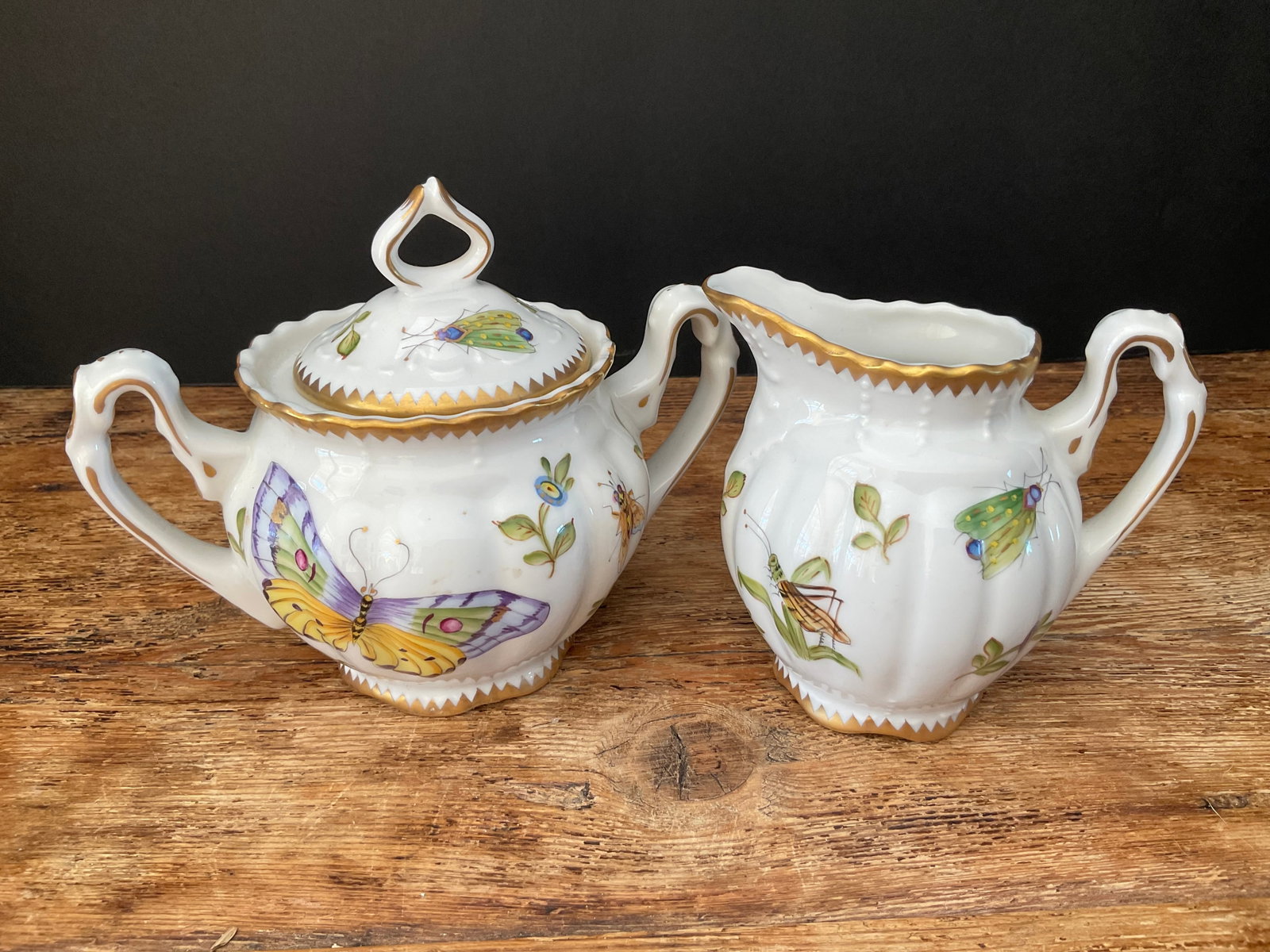 Creamer & Sugar Set from Anna Weatherley: A creamer & sugar set by Anna Weatherley. This porcelain piece is hand painted in the Weatherley studio in Hungary. Dated 2001, excellent condition. Sugar bowl is 5 x 6".